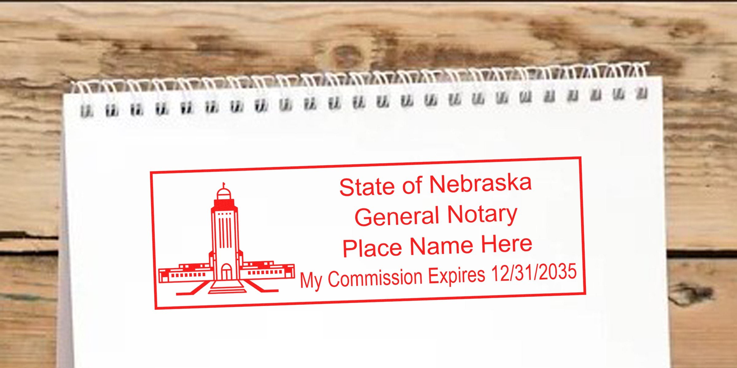 Nebraska notary seal with commission expiration date on white notepad. Purchase your notary seal online today.