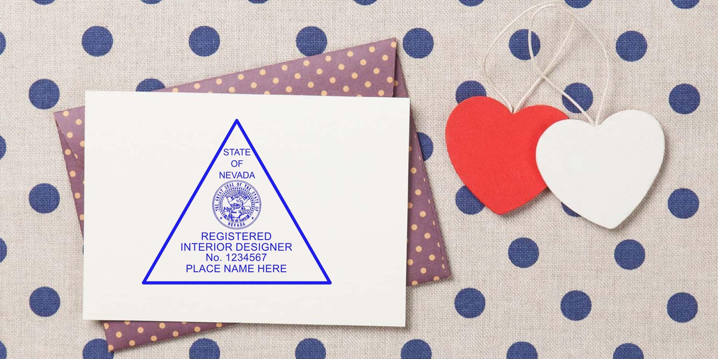 Nevada Interior Designer Stamp on white card with purple polka dot envelope, red and white heart decorations, and Interior Design Certification Nevada seal.