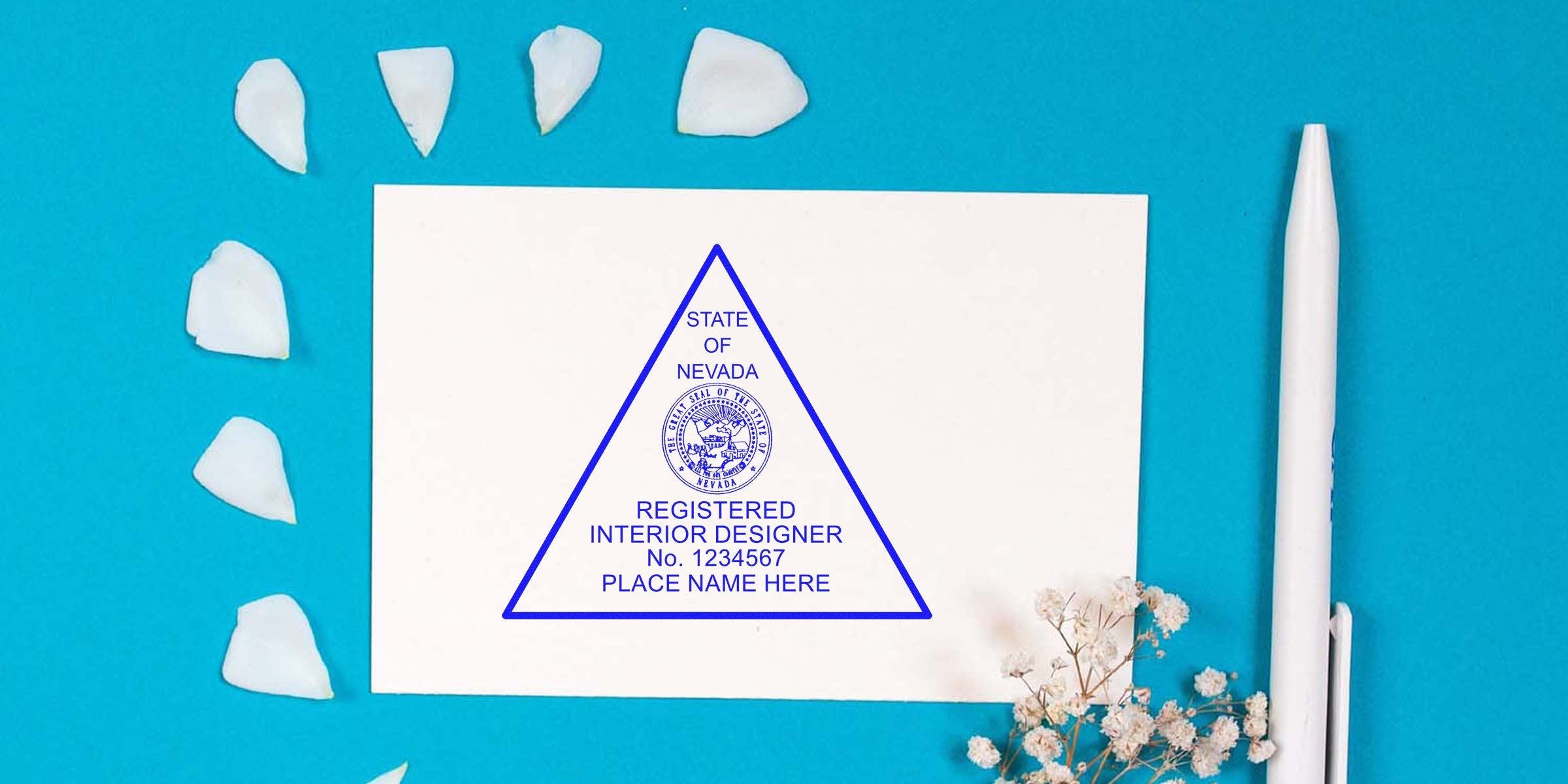 Nevada interior designer certificate with Nevada stamp, white pen, and flower petals on blue background, showcasing easy stamp purchase.