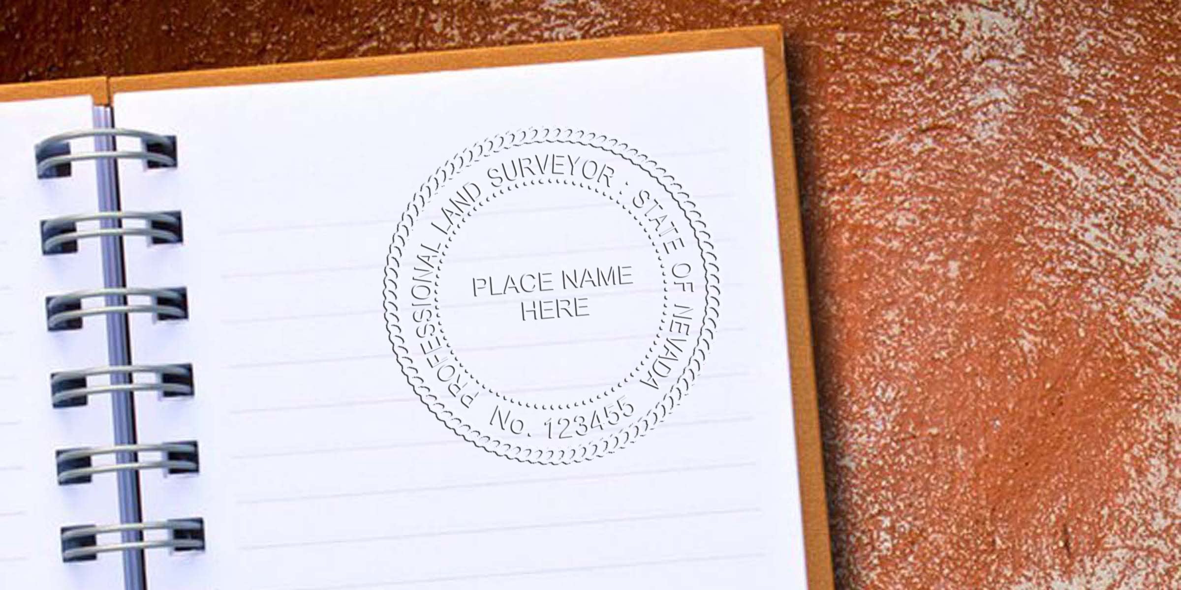 Nevada land surveyor stamp on notebook page emphasizing land surveying regulations for professional services in Nevada.