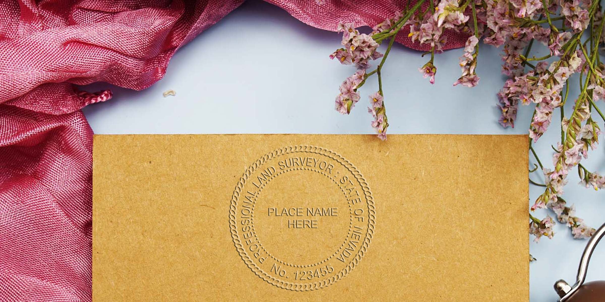 Professional Nevada land surveyor embossed seal on brown paper with pink fabric and flowers, showcasing stamp size and tips for selecting a land surveyor stamp.
