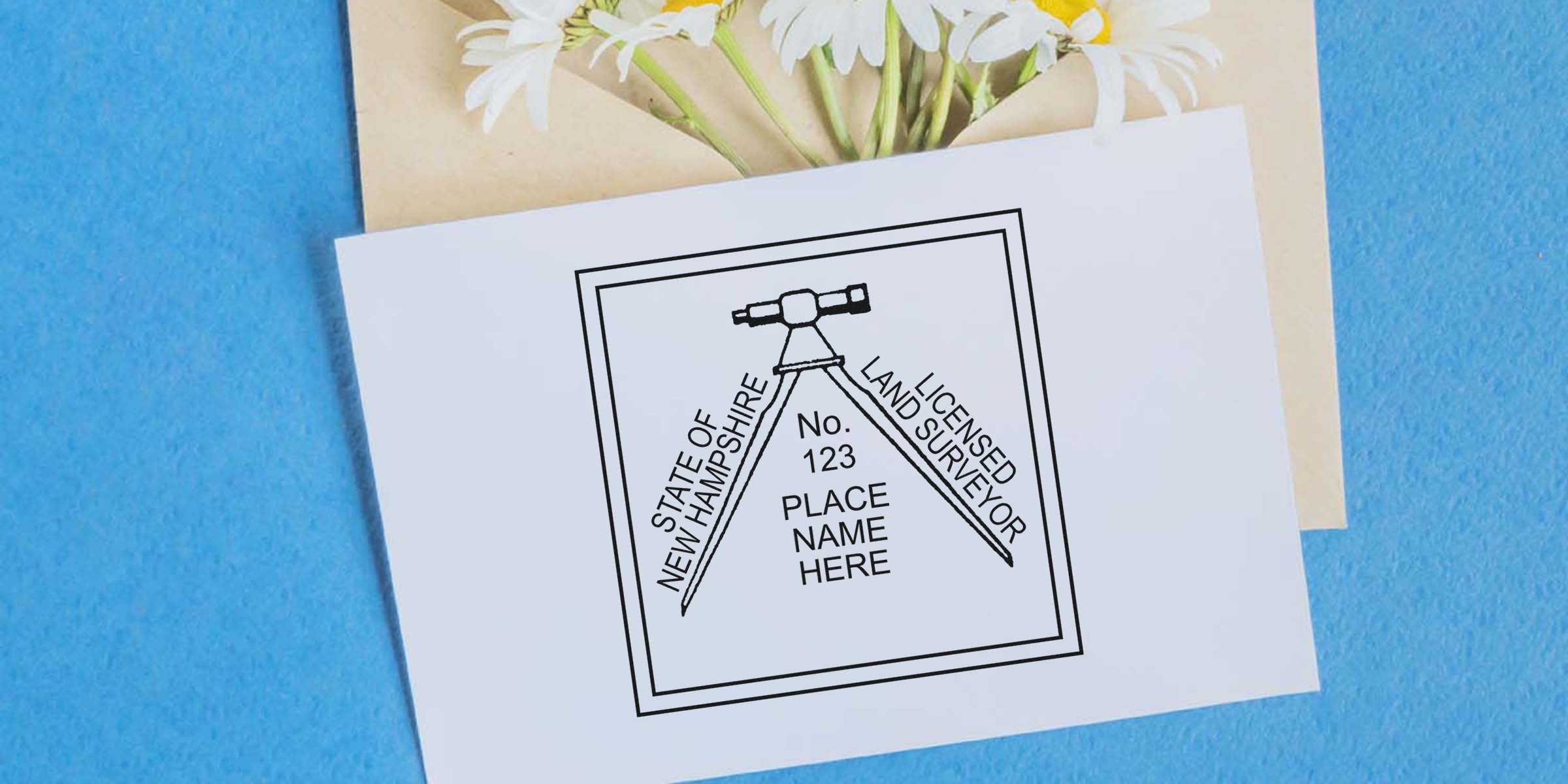 New Hampshire land surveyor seal stamped on white paper with flowers and a blue background, showing the land surveyor seal process.