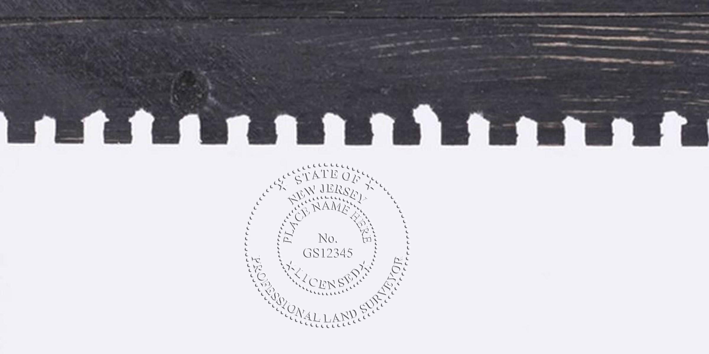 NJ Surveyor Stamp embossed on white paper with black wooden background, showing the New Jersey Land Surveyor Seal.
