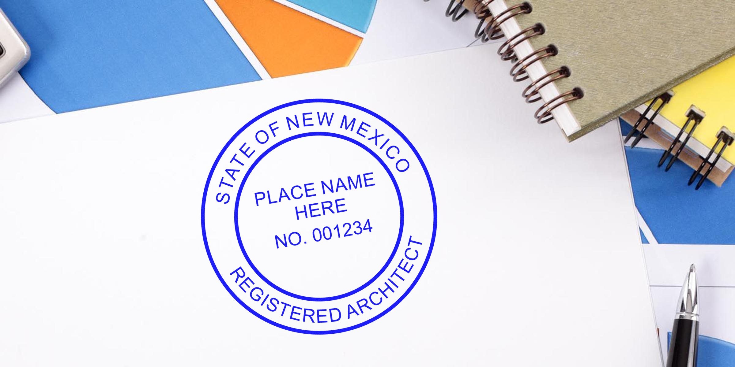 New Mexico architect stamp on office desk with notebooks and pen, highlighting architect stamp and requirements in New Mexico.