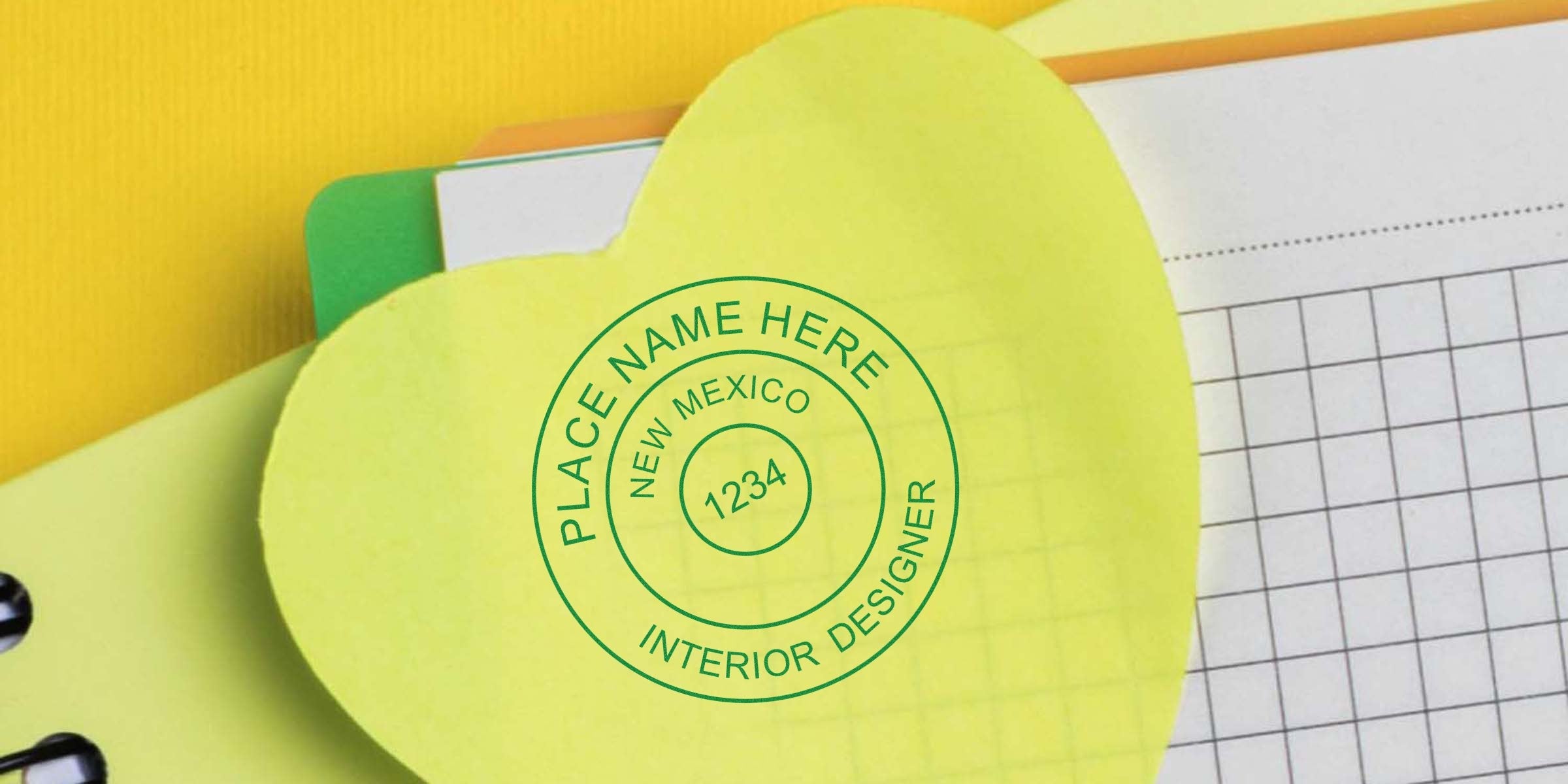 Yellow heart-shaped sticky note with a New Mexico interior designer stamp on an office supplies background, showcasing the interior designer stamp process.