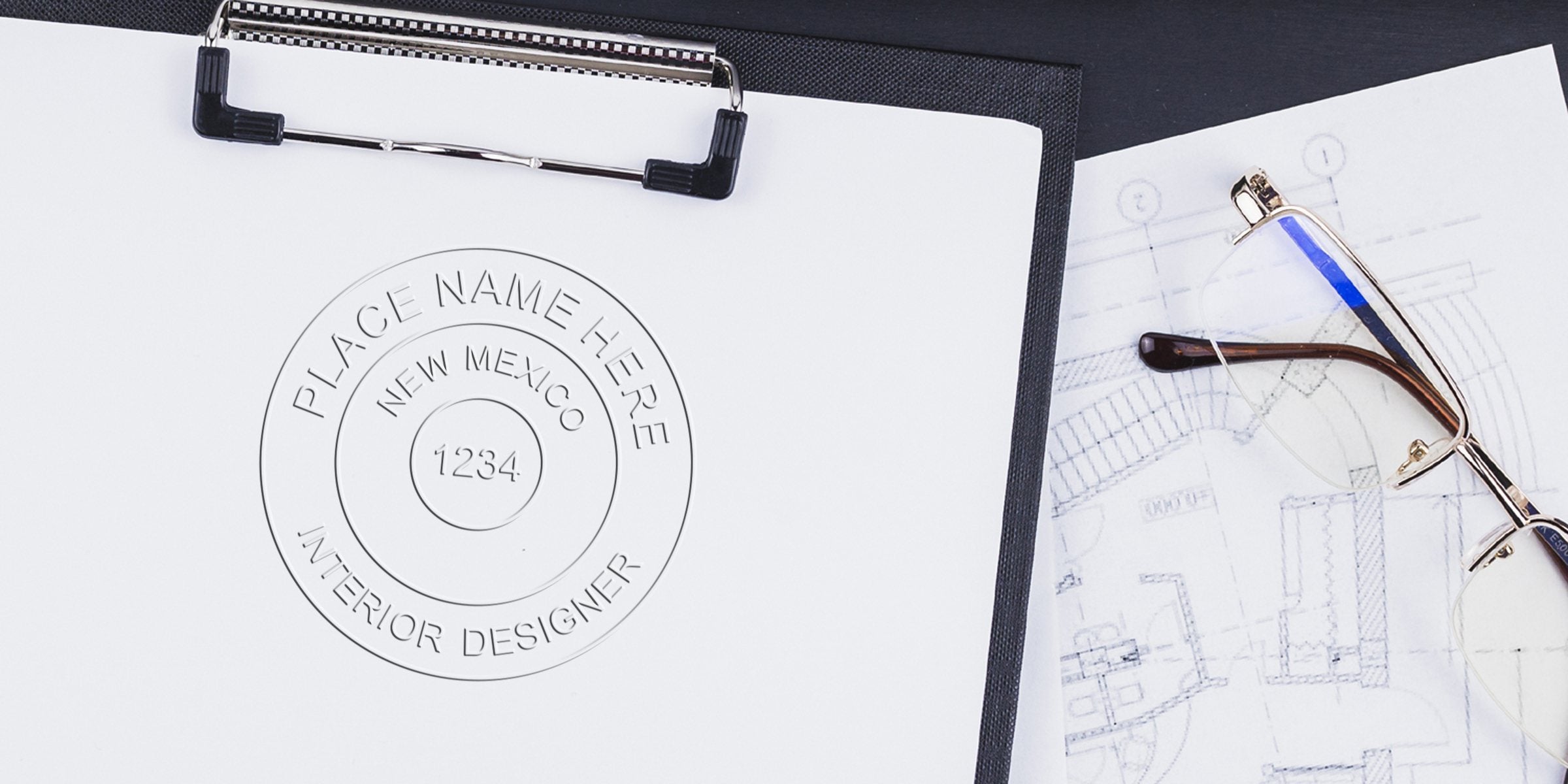 Clipboard with New Mexico interior design stamp, architectural blueprint, and eyeglasses, highlighting NM interior designer regulations.