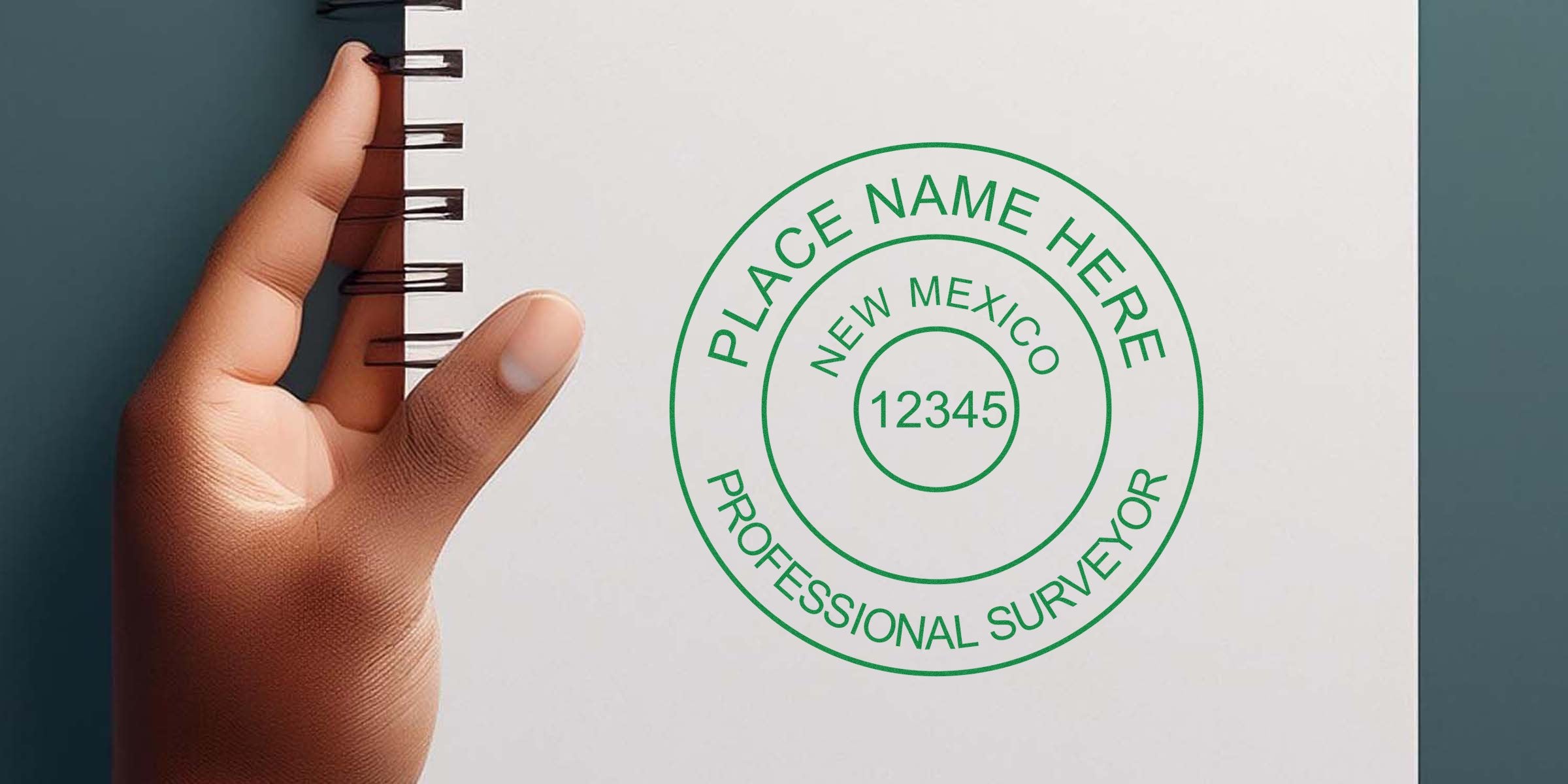 Hand holding notebook with New Mexico land surveyor stamp and professional seal, highlighting common mistakes in buying land surveyor stamps.