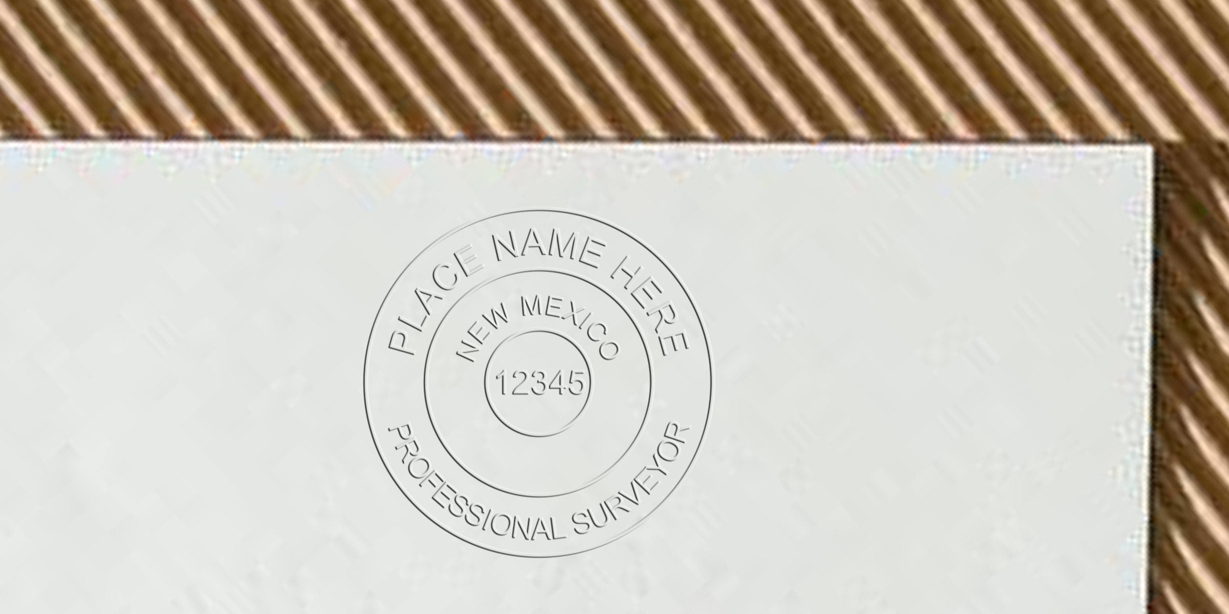 New Mexico land surveyor embossed seal on white paper, adhering to land surveyor stamp design guidelines.