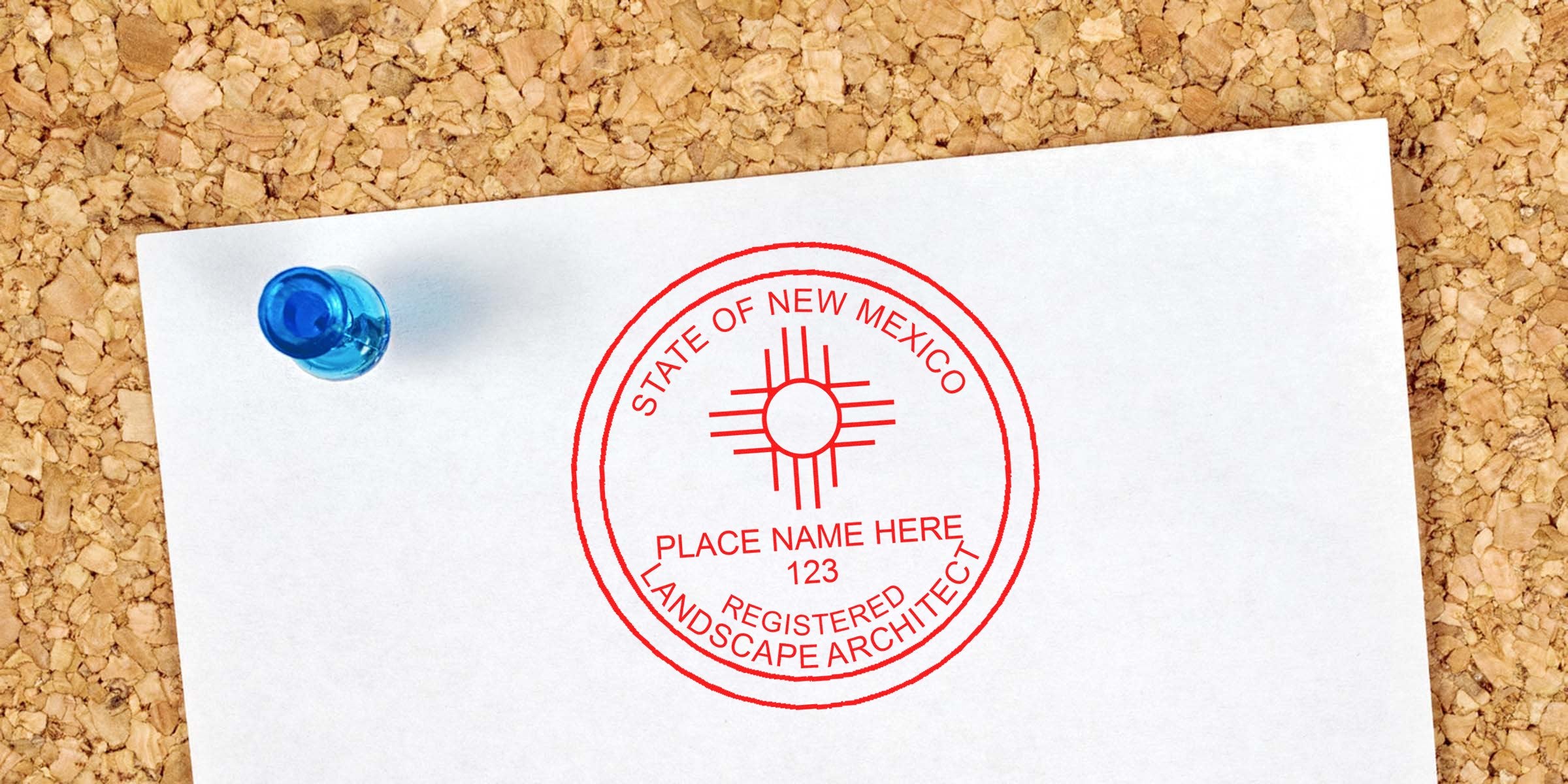 New Mexico landscape architect stamp on white paper pinned to corkboard, related to stamp and license renewal process.