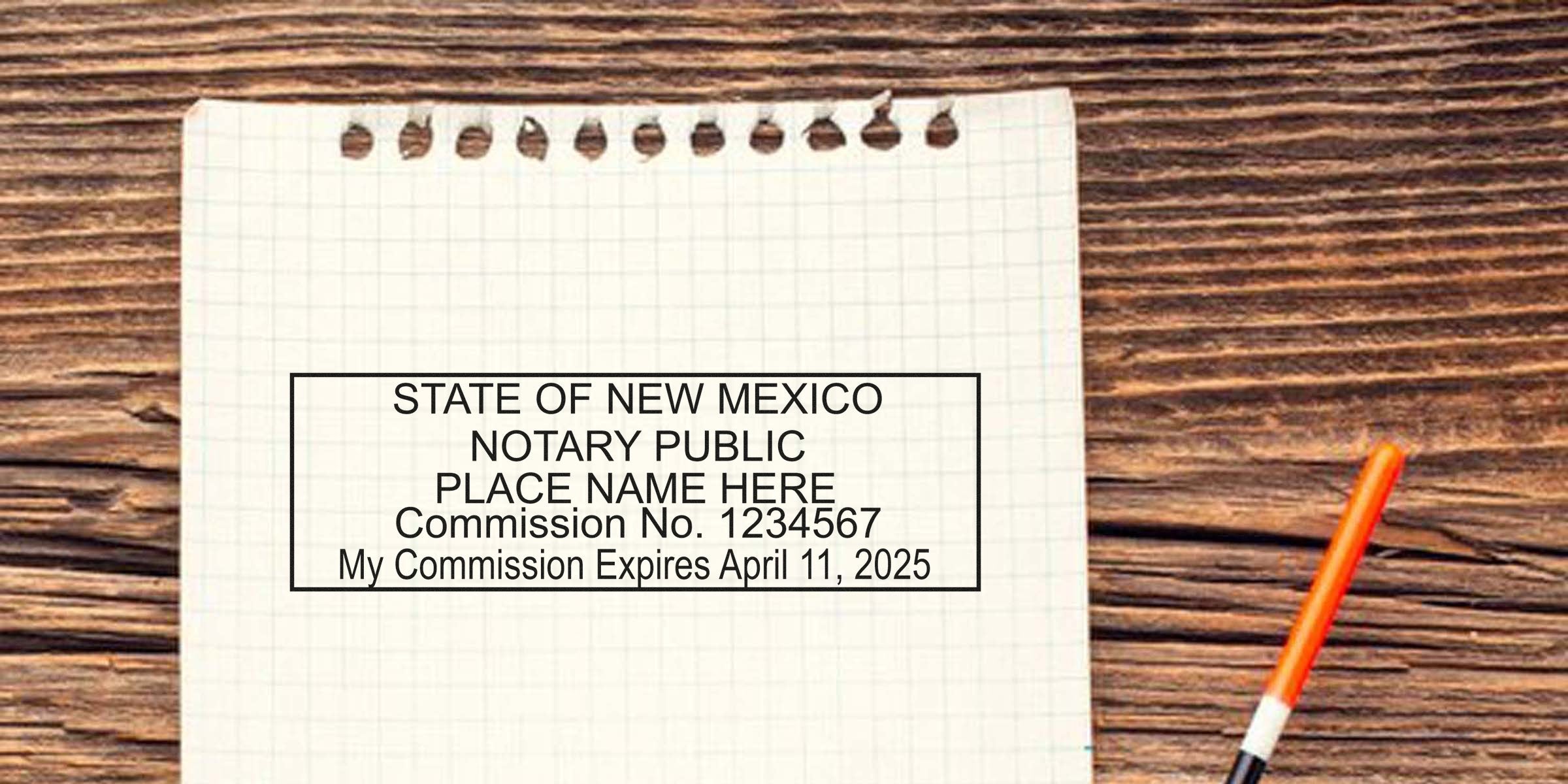 New Mexico notary seal stamped on grid paper with an orange pen on a wooden table, showcasing the advantages of a notary stamp.