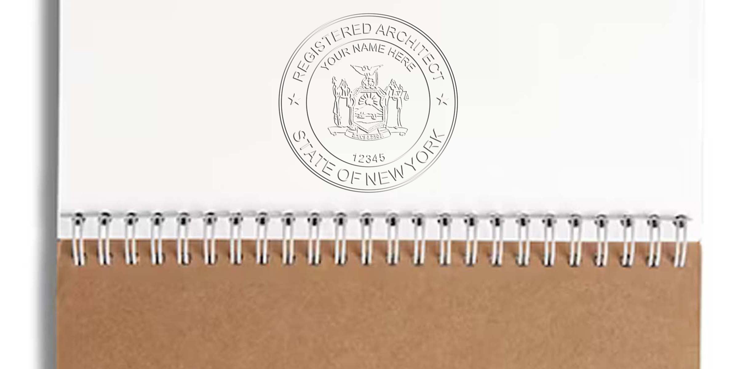 Custom Architect Seals with the New York Architect Seal embossed on a spiral notebook for professional certification verification.