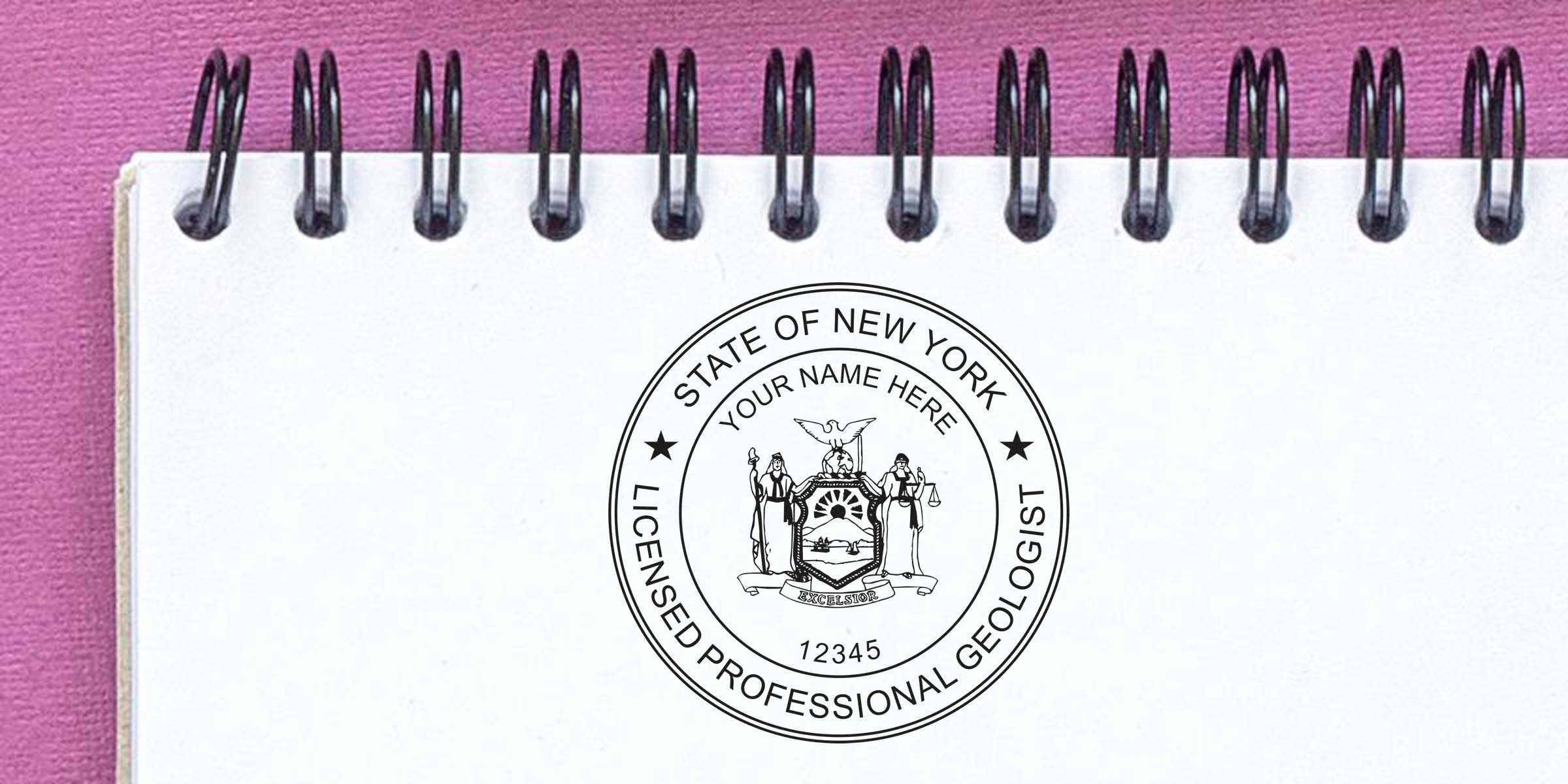 New York geologist stamp on white spiral notebook with pink background, showing licensed professional geologist seal and stamp requirements.
