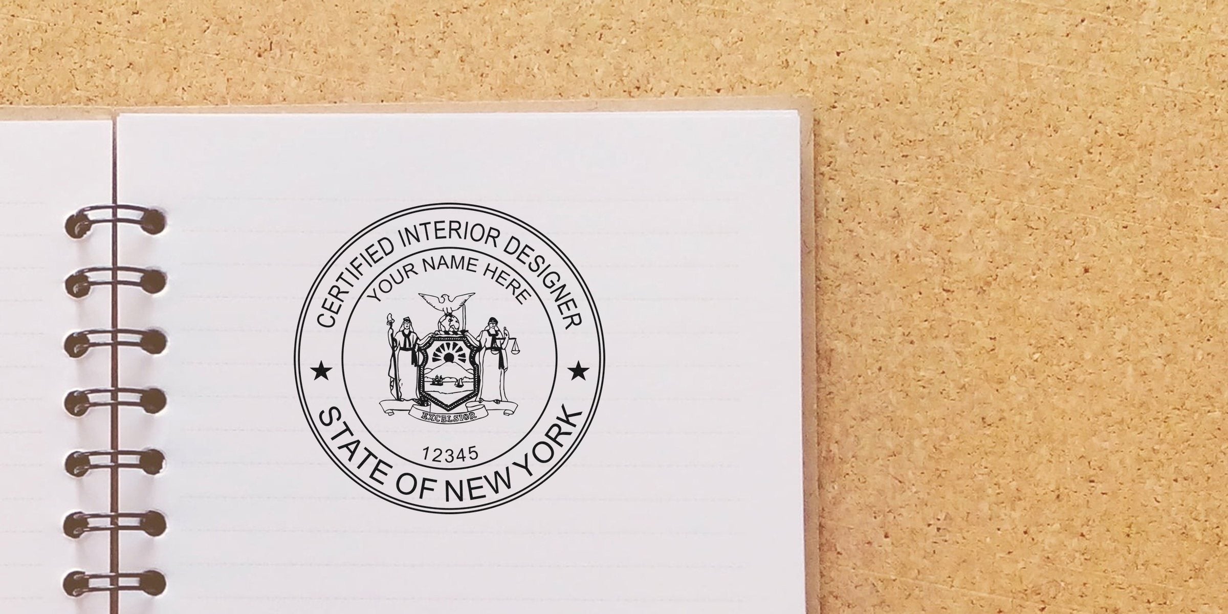 Custom Interior Designer Stamp with New York Interior Design Stamp and official New York state seal on a notebook page.