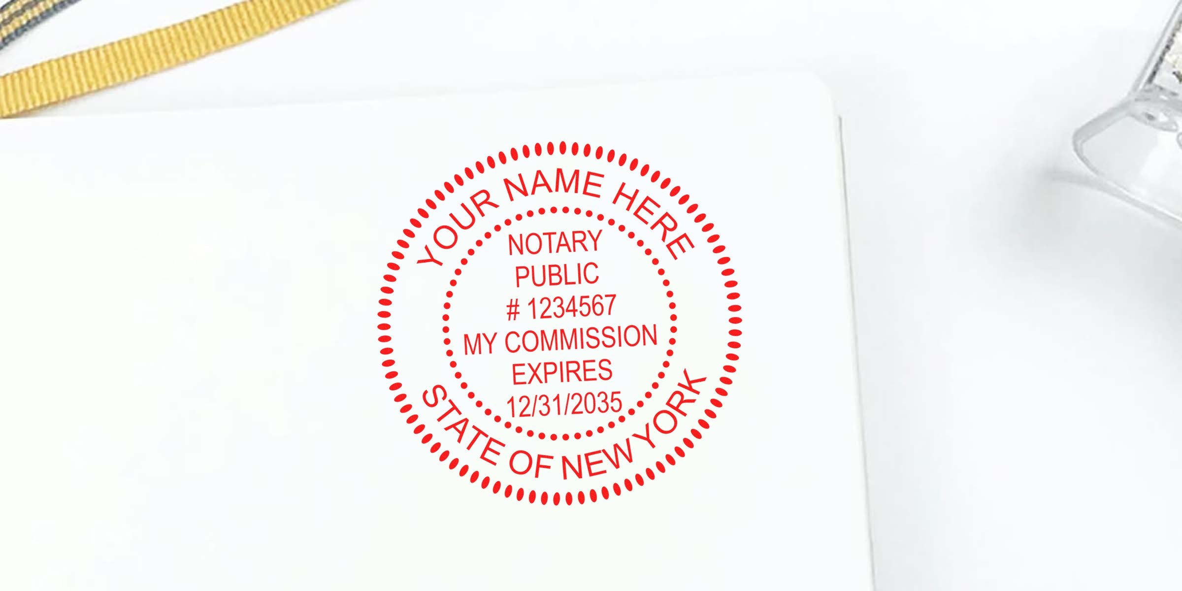 Red NY notary seal with a notary public stamp for New York, showing commission expiration date on white paper, compliant with NY notary rules.