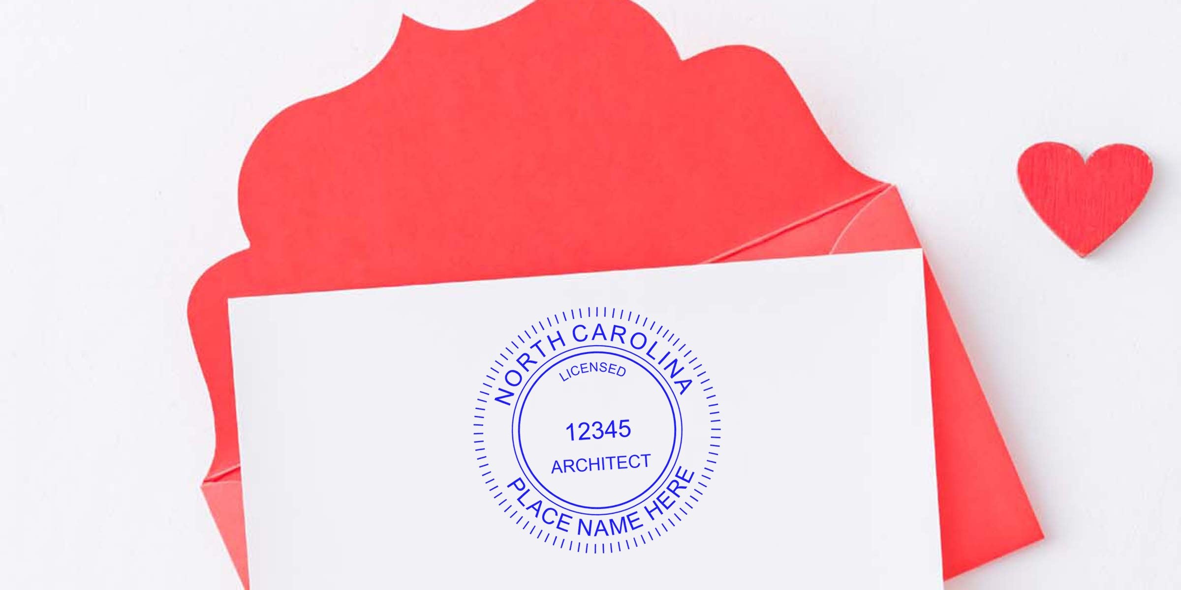 North Carolina architect seal embossed on white card, paired with a red envelope and heart shape.