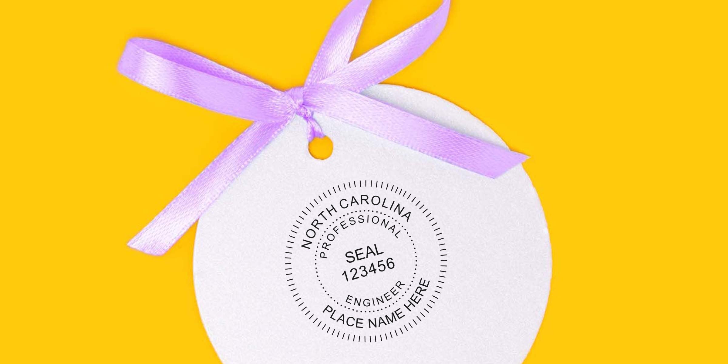 North Carolina Professional Engineer Seal with purple ribbon on yellow background, showing NC PE Seal requirements and Professional Engineer Seal for North Carolina.