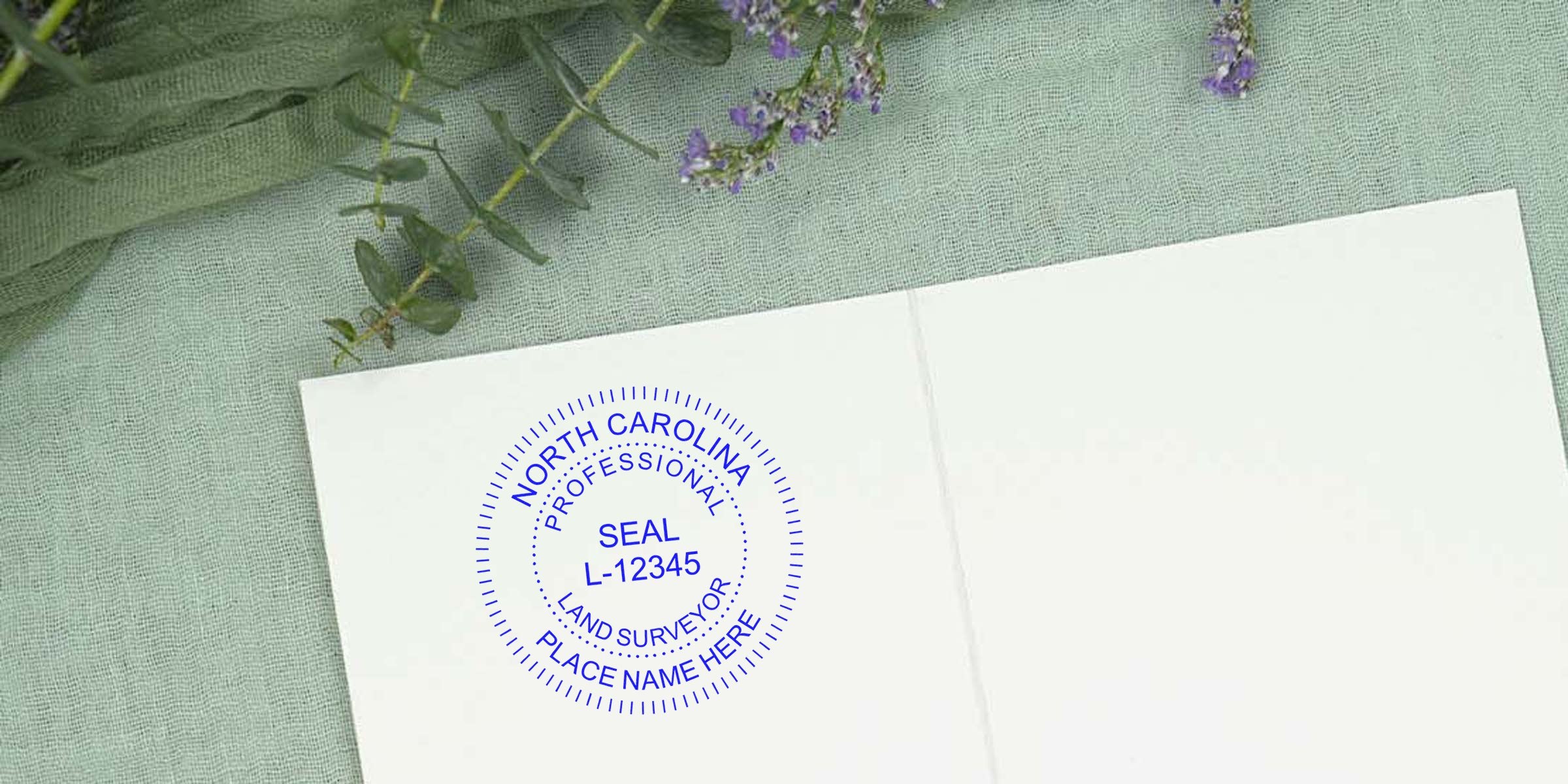 North Carolina land surveyor seal stamp on white paper with greenery, showing NC land surveyor seals and seal requirements.