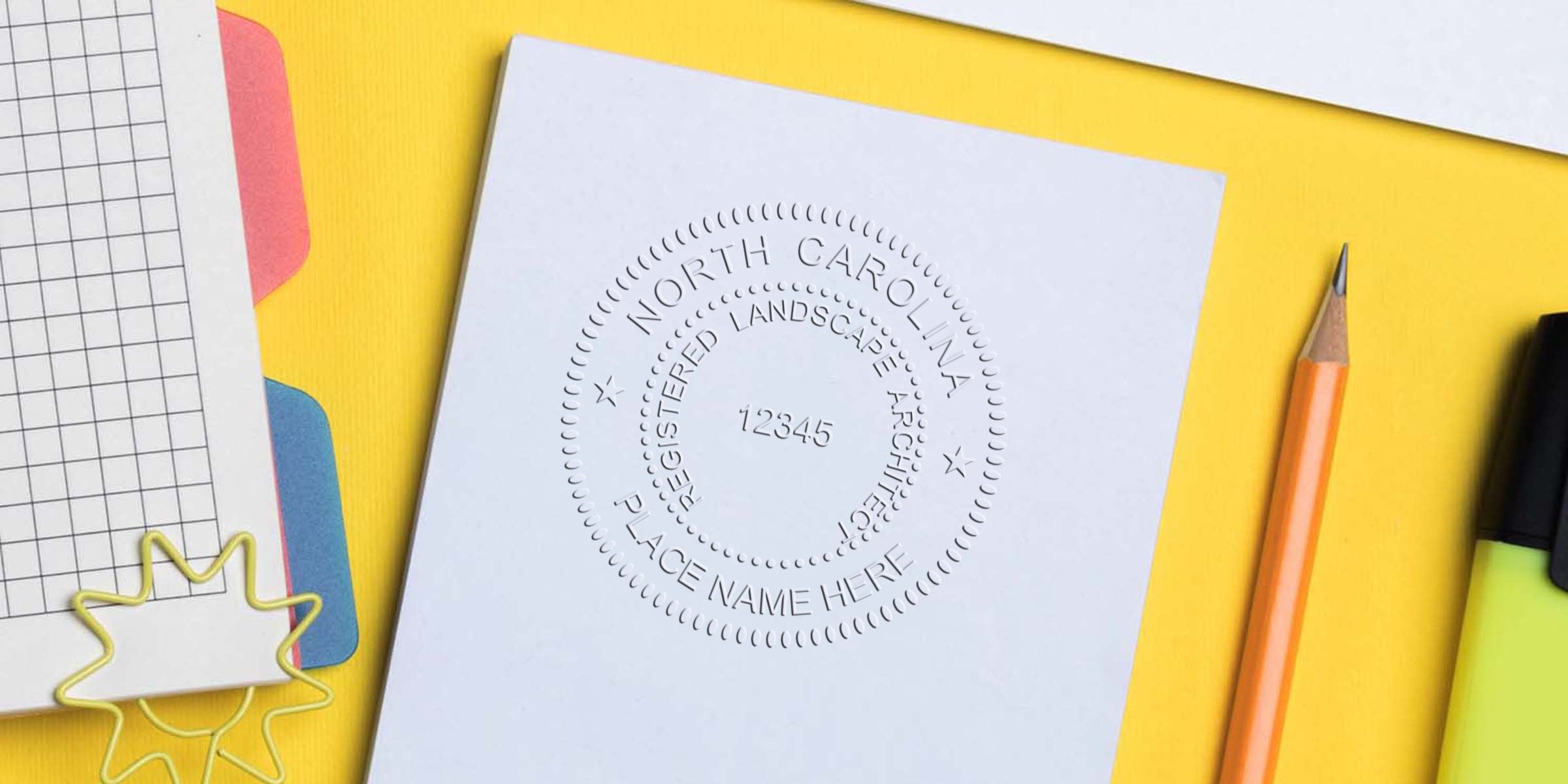 North Carolina landscape architect seal on white paper with pencil and highlighter on yellow background, emphasizing seal authenticity tips.