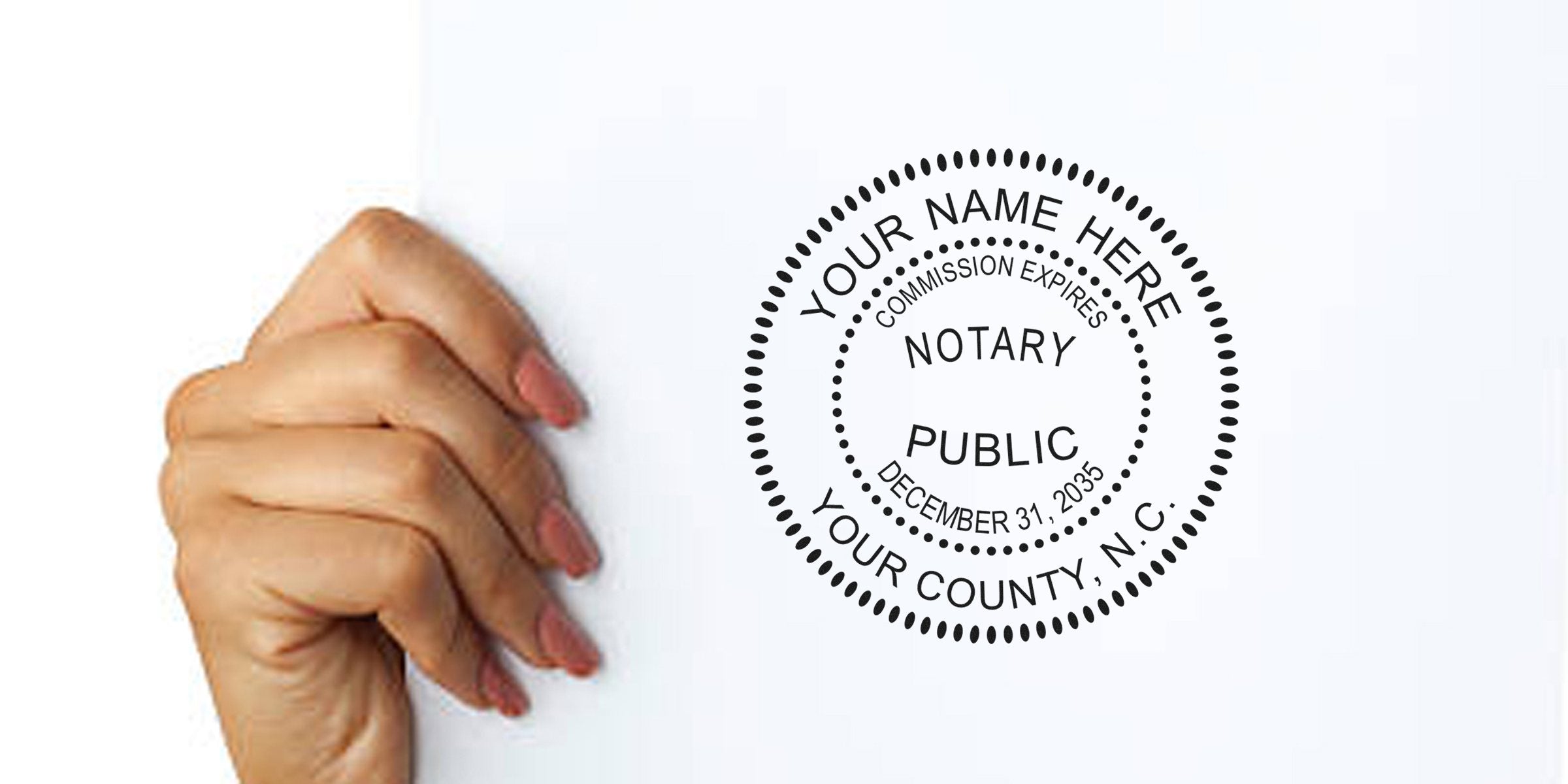 Hand holding a North Carolina notary stamp with commission expiration date, alongside essential NC notary supplies and tools.