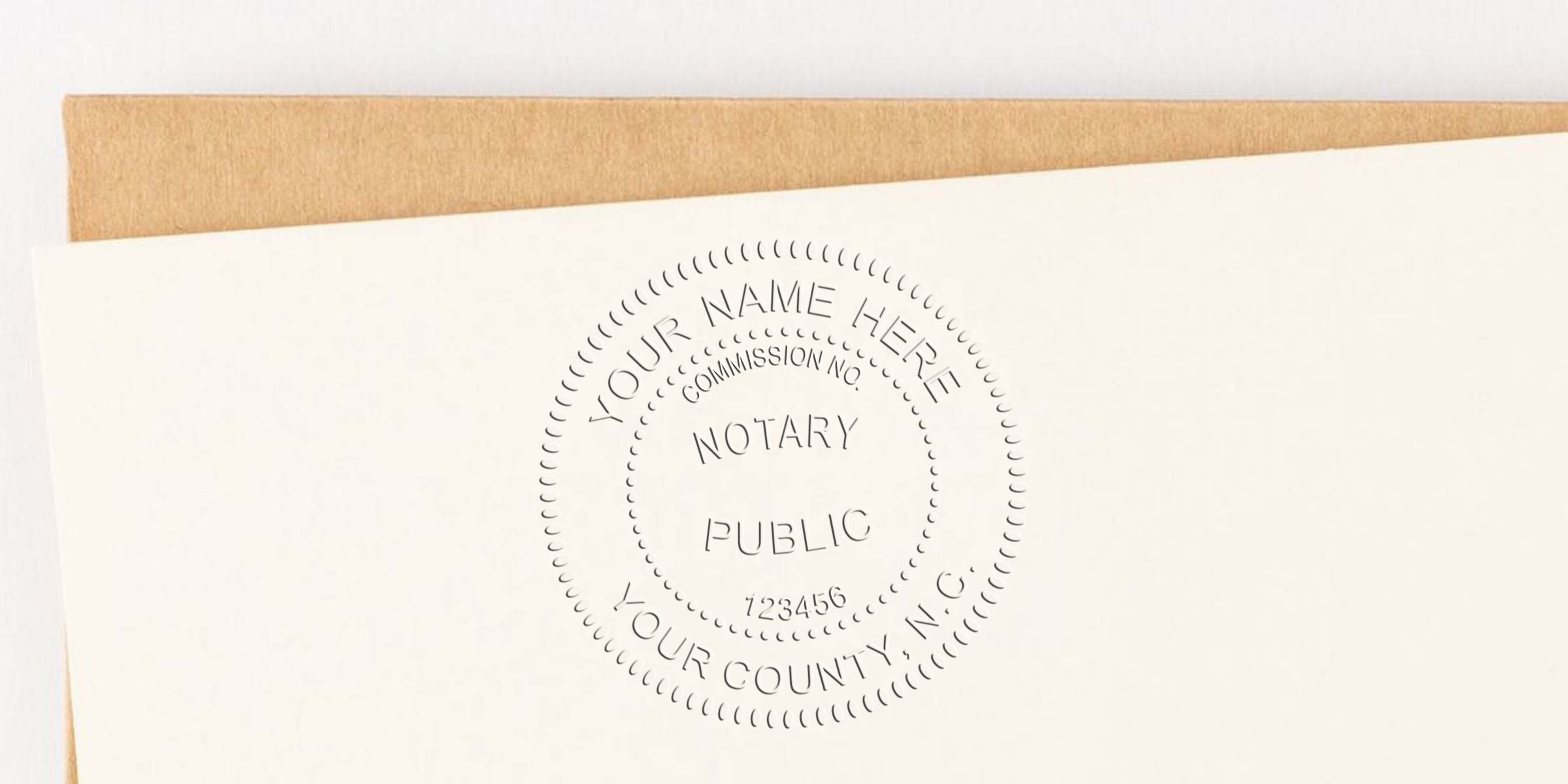 Notary public embossing seal on white paper with brown envelope, showing official stamp design; includes essential North Carolina notary supplies and useful notary public shopping tips.
