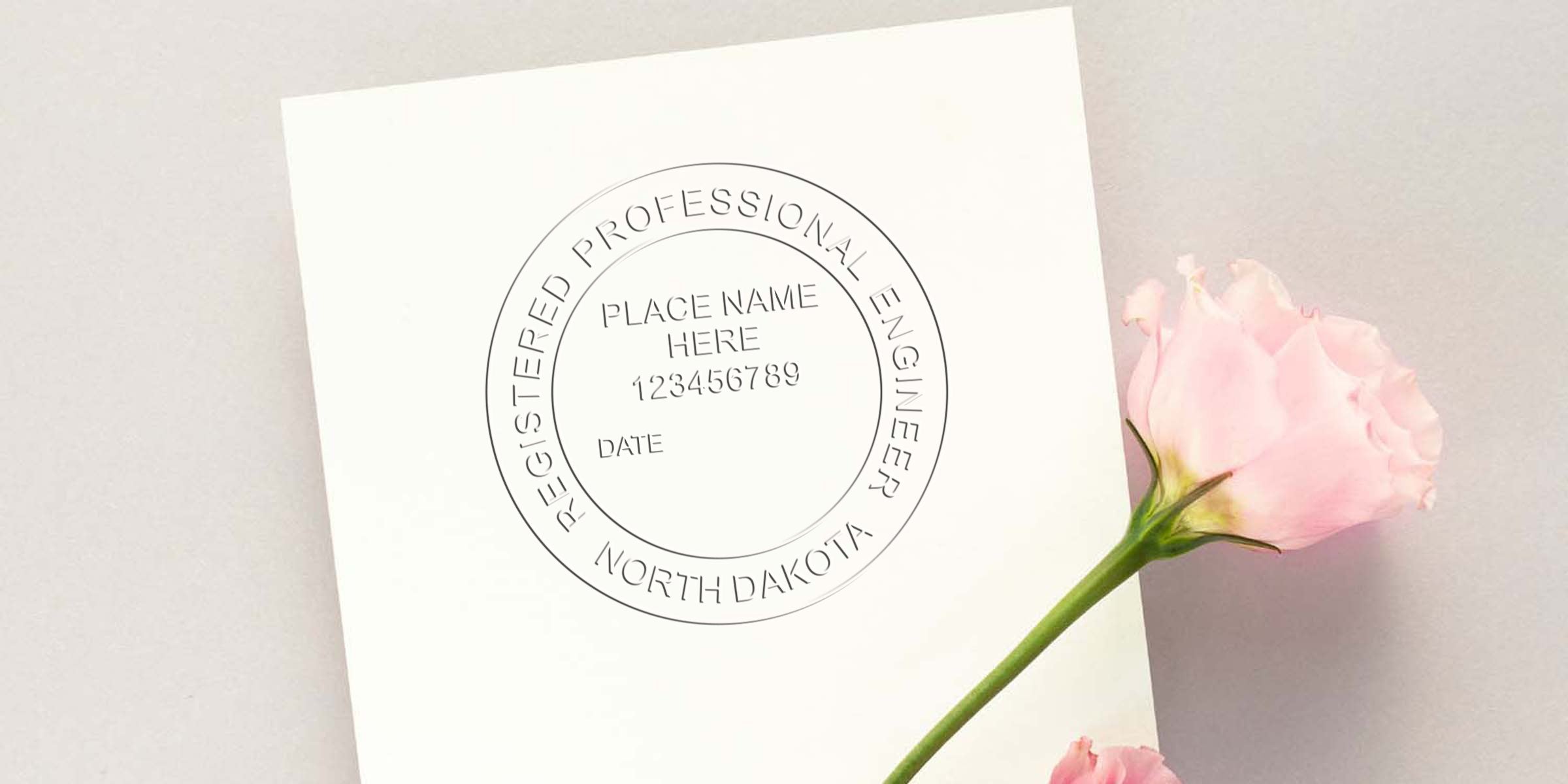 Custom engineer seals with a registered North Dakota professional engineer seal on white paper, featuring a pink rose symbolizing North Dakota quality.