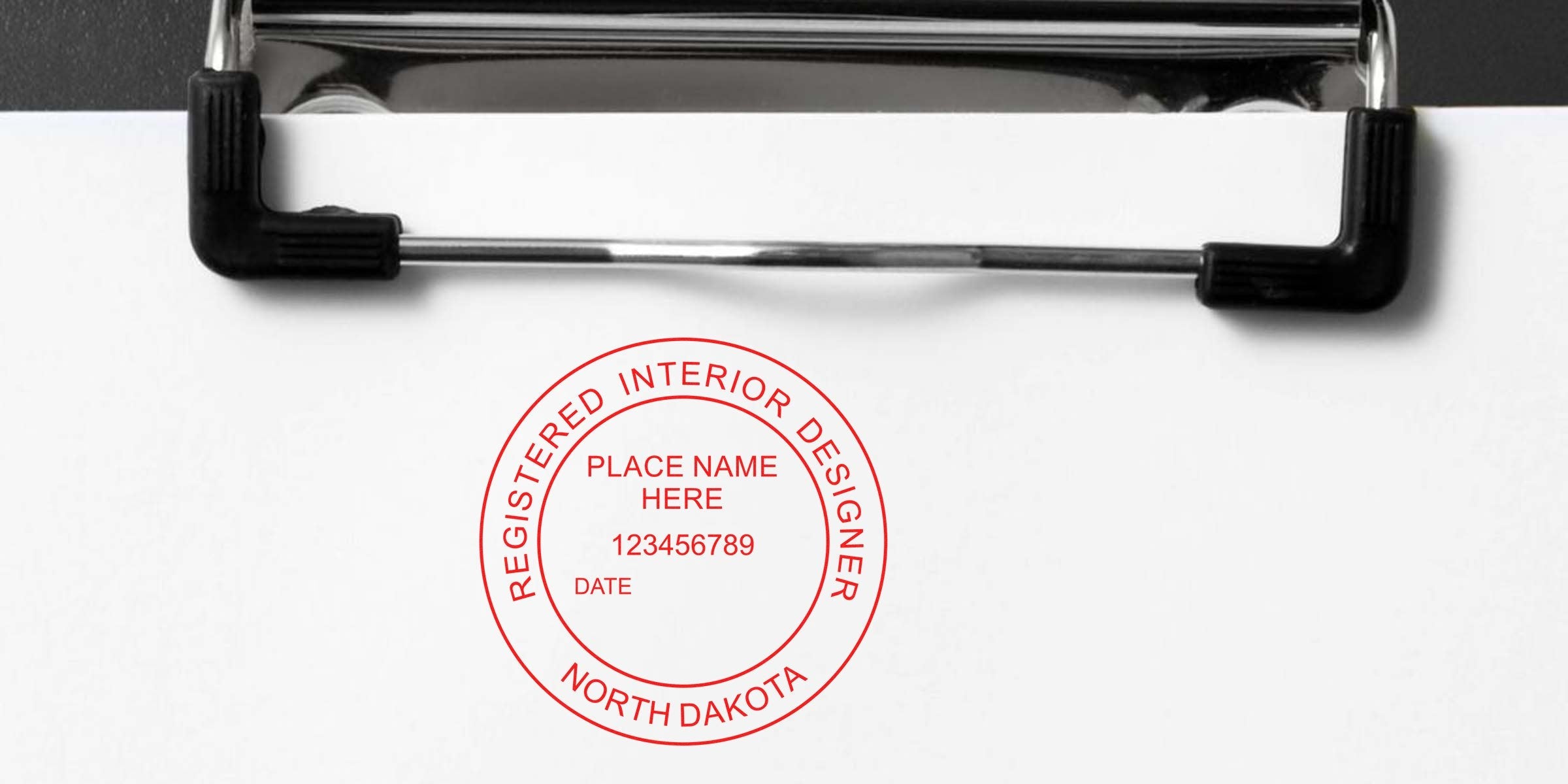 North Dakota interior designer stamp on clipboard paper, emphasizing ND interior design regulations.