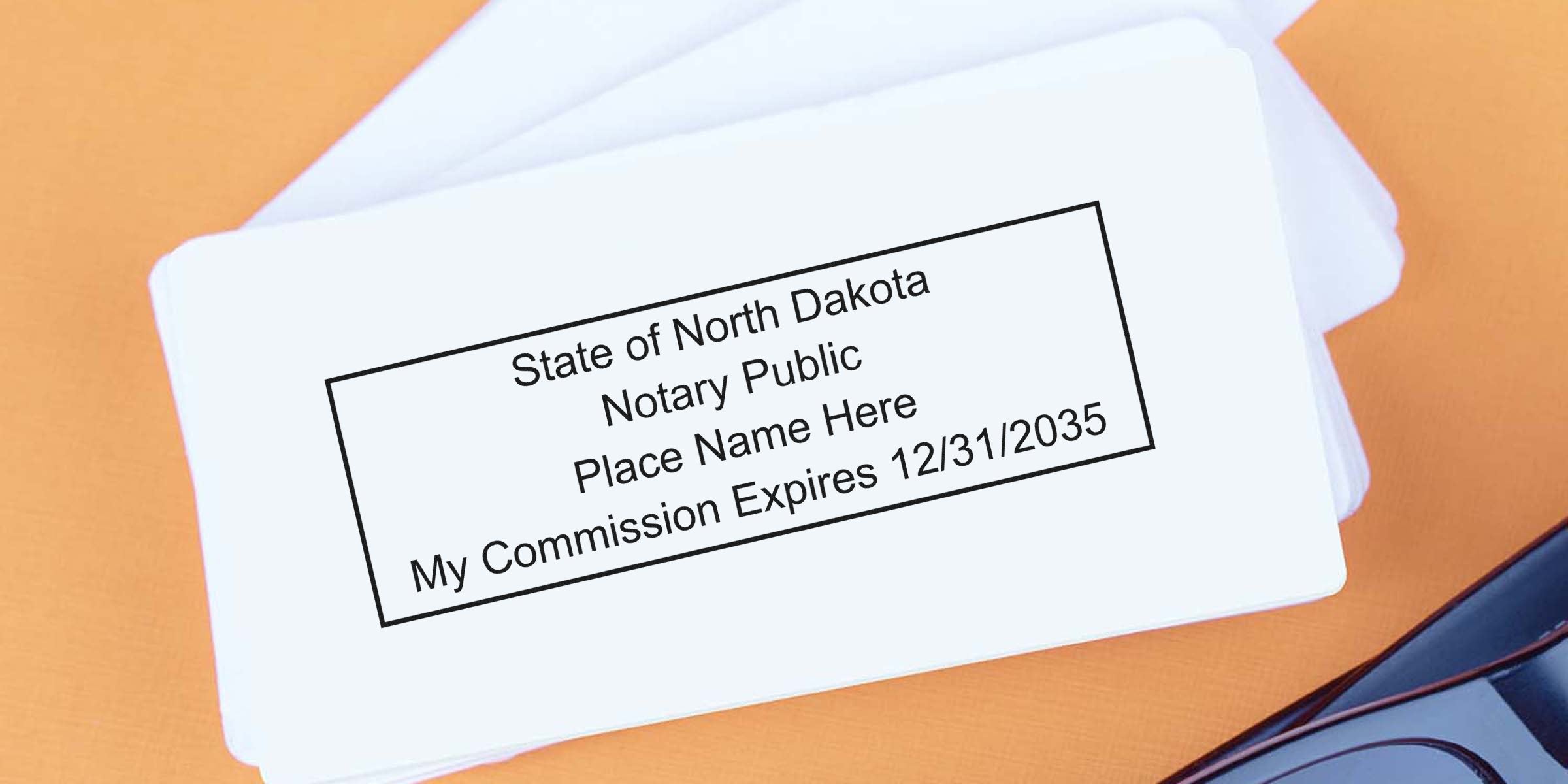 North Dakota notary public stamp with commission expiration date on white cards, offering trusted vendors and official notary supplies.