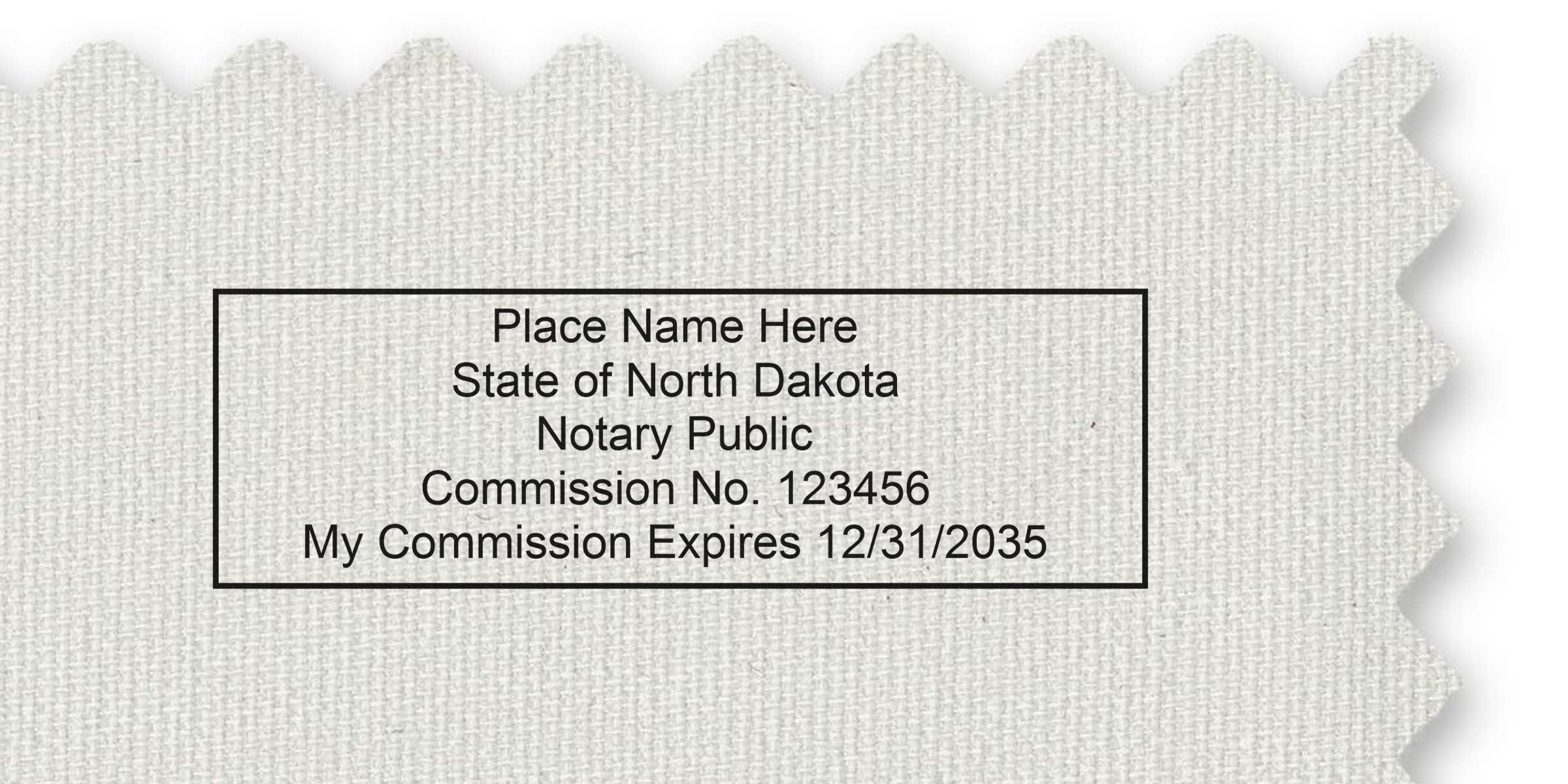 North Dakota notary public commission certificate with official seal on textured fabric background. Option to purchase notary seal online available.