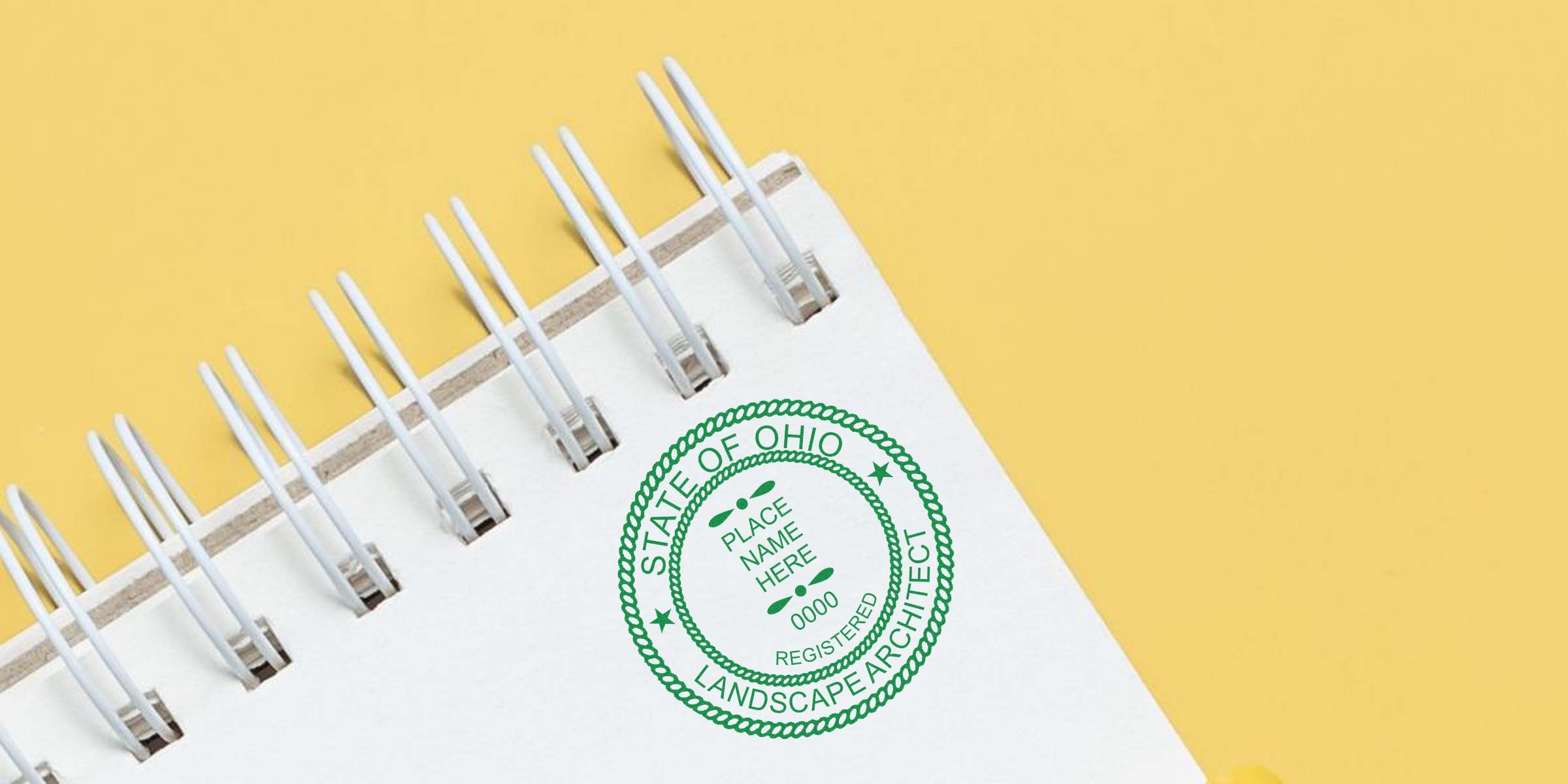 Ohio Landscape Architect Seal stamped on a spiral notebook with a yellow background, showcasing the Landscape Architect Seal Template design.