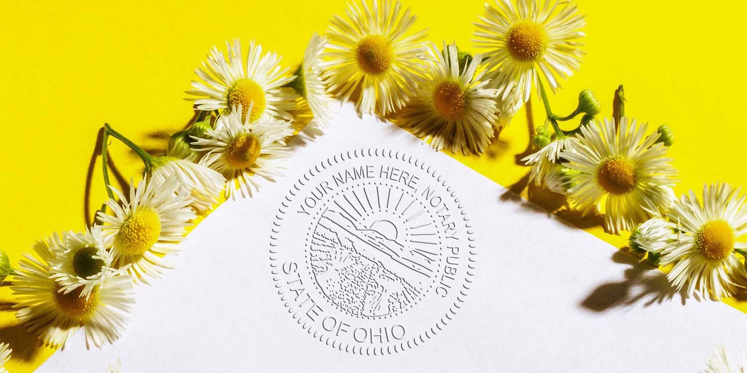 Ohio notary public seal embossed on white paper with daisies on yellow, meeting Ohio notary seal rules for official services.