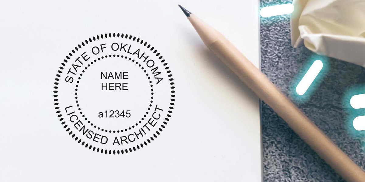 Oklahoma architect seal on a stamp with pencil and crumpled paper on a desk, highlighting the stamp tips.