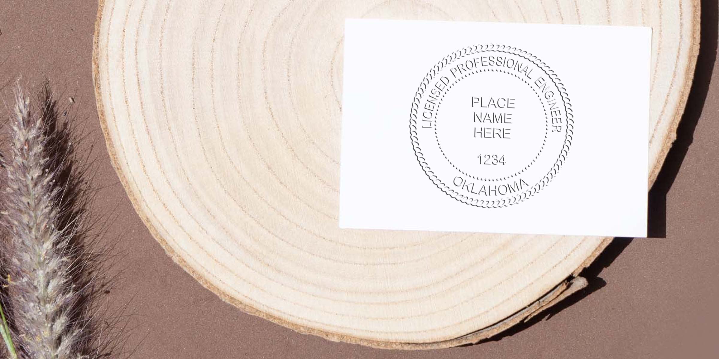 Professional Engineer Stamp on white card with wooden background, featuring Oklahoma Engineering License seal.