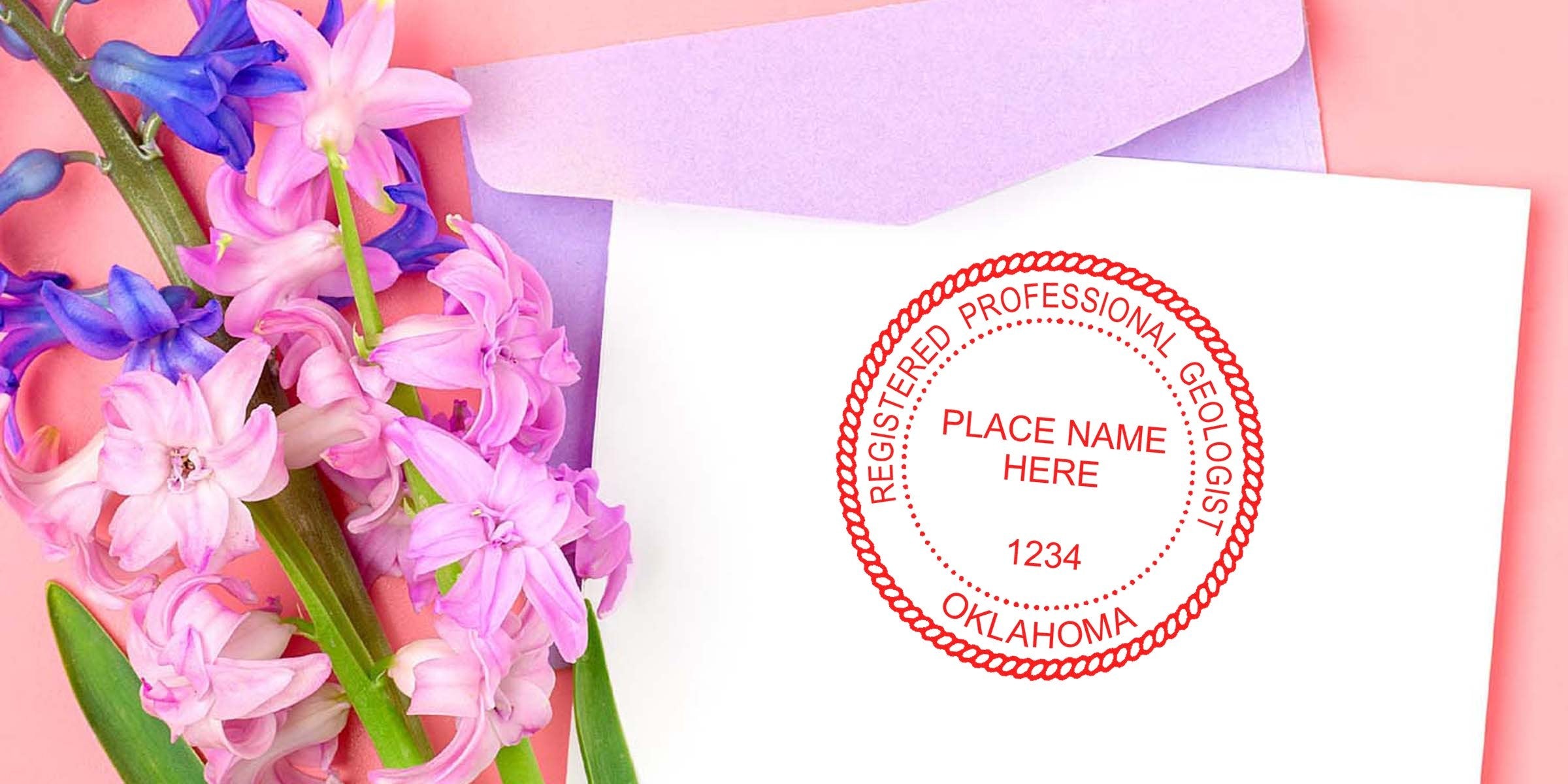 Pink and purple hyacinths next to Navigating Geologist and Oklahoma Geologist stamps on white paper, with a lavender envelope on a pink background.