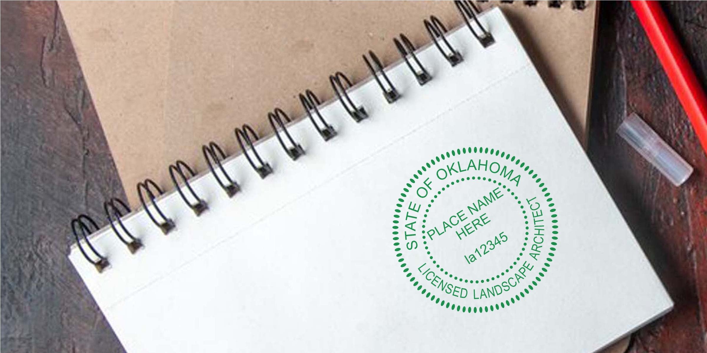 Notebook with Oklahoma landscape architect stamp, professional certification, and official architect seal on white paper, highlighting Oklahoma landscape architect seal maker choices.