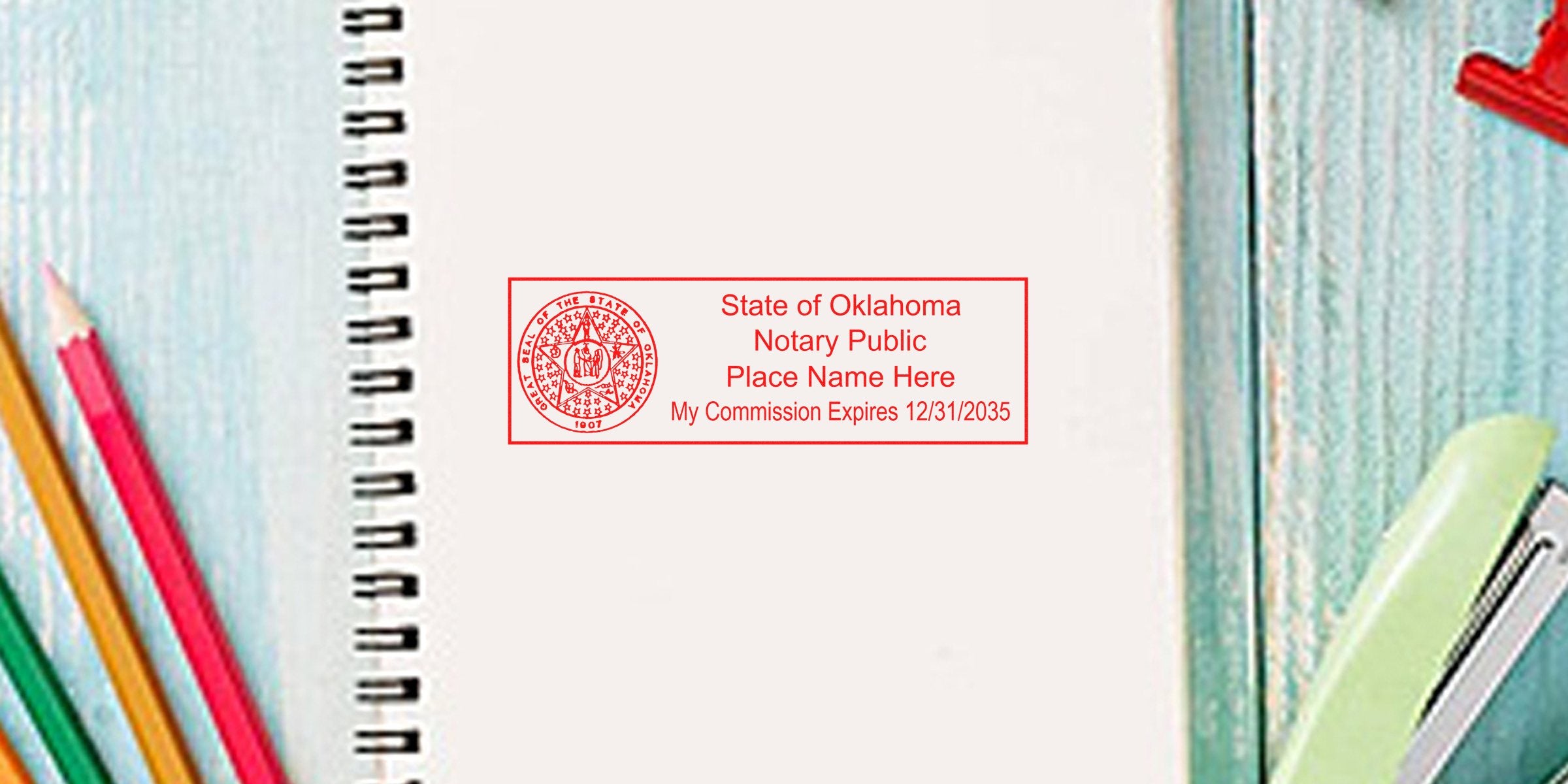 Oklahoma notary stamp on notebook with colored pencils and stapler, essential supplies for commission expiration verification.
