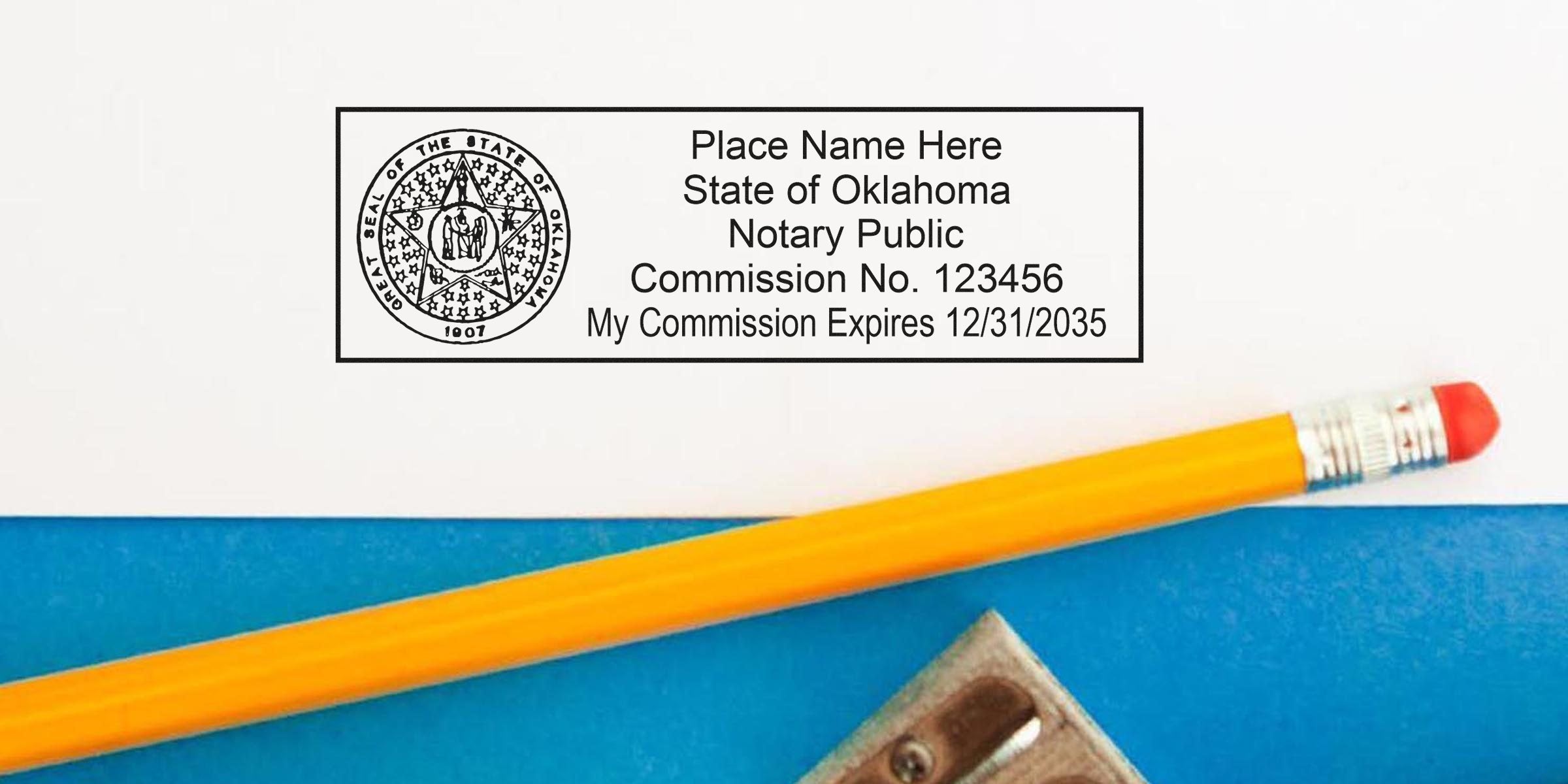 Oklahoma notary public commission certificate with pencil and sharpener on blue background, featuring Oklahoma notary stamp and stamp requirements.