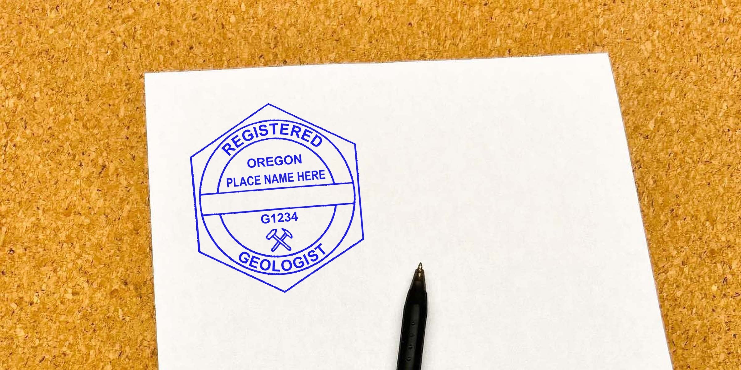 Oregon Geologist Stamp on white paper with pen, shown on corkboard background, includes Stamp Purchase Tips.