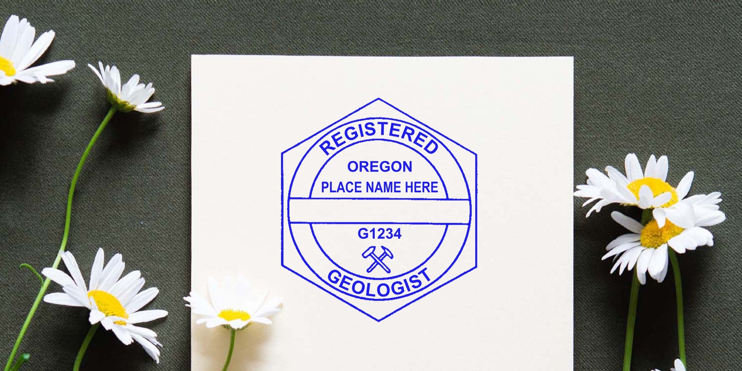 Oregon geologist stamp with location and license number on white paper, surrounded by daisies, illustrating Oregon geologist stamp rules.