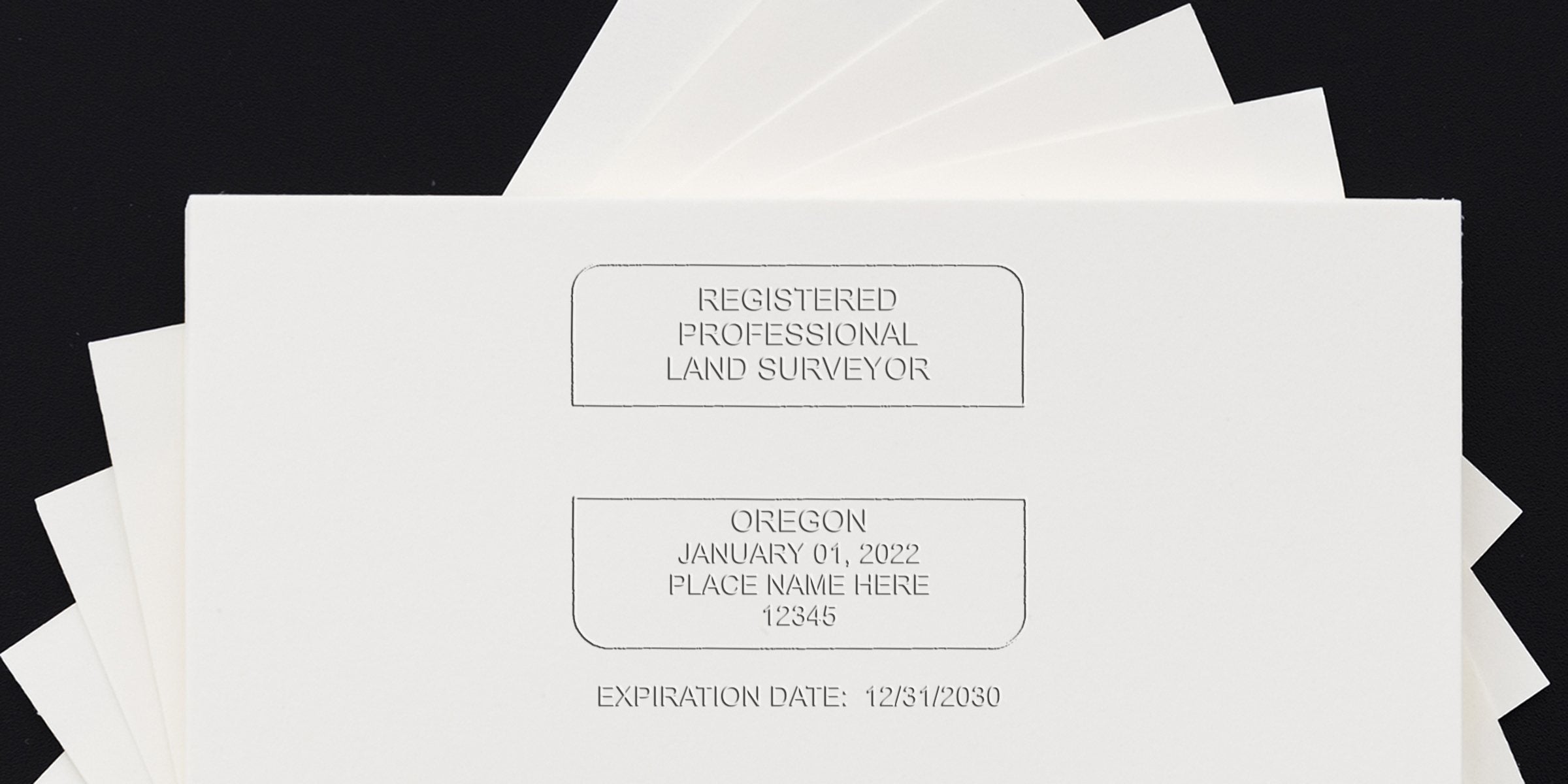Registered professional land surveyor stamp with Oregon seal and expiration date on white paper, meeting land surveyor seal guidelines.