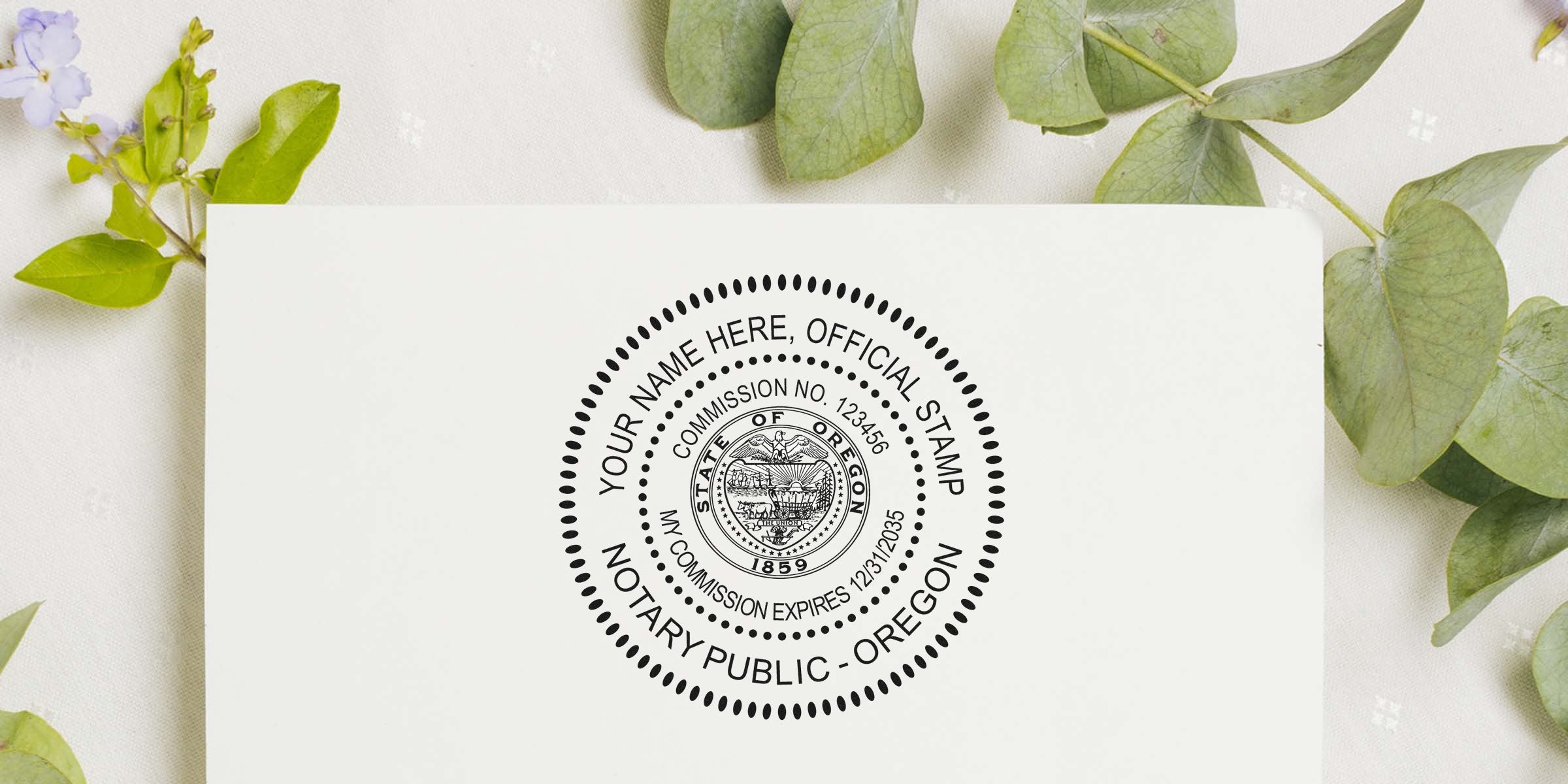 Oregon notary seal with commission number and expiration date on white paper, framed by green leaves; purchase notary seals online.