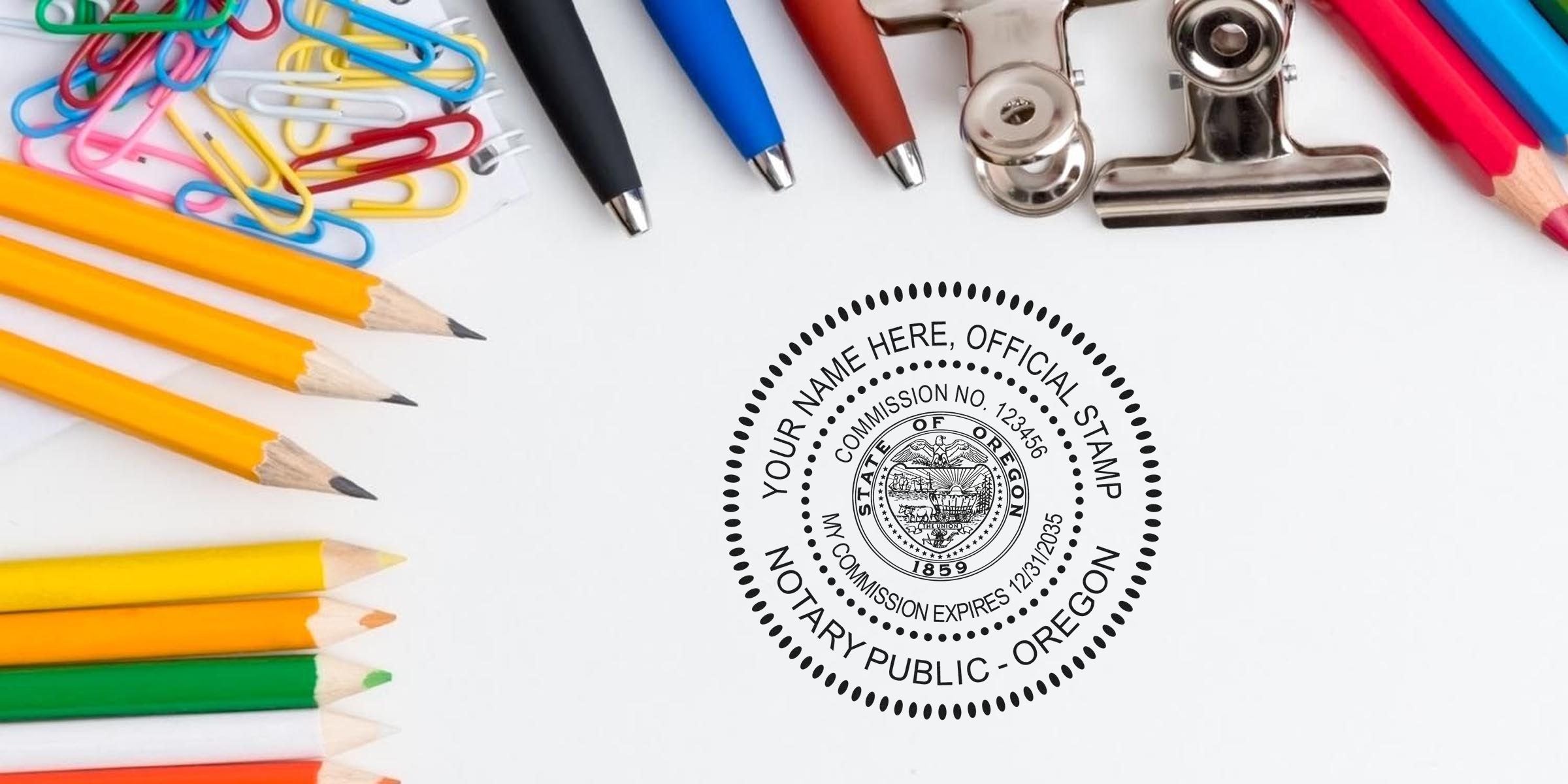 Oregon notary stamp format shown with official notary stamp, colorful pencils, pens, paper clips, and binder clip on white background, displaying a sample Oregon notary stamp.