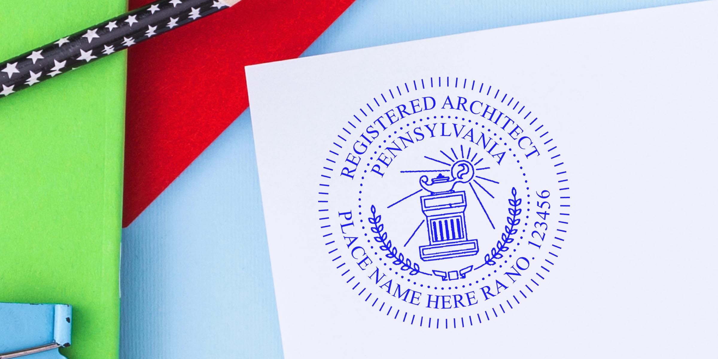 Pennsylvania architect stamp on white paper with colorful background, black star-patterned pencil, featuring PA registered architect seal and online architect stamp.