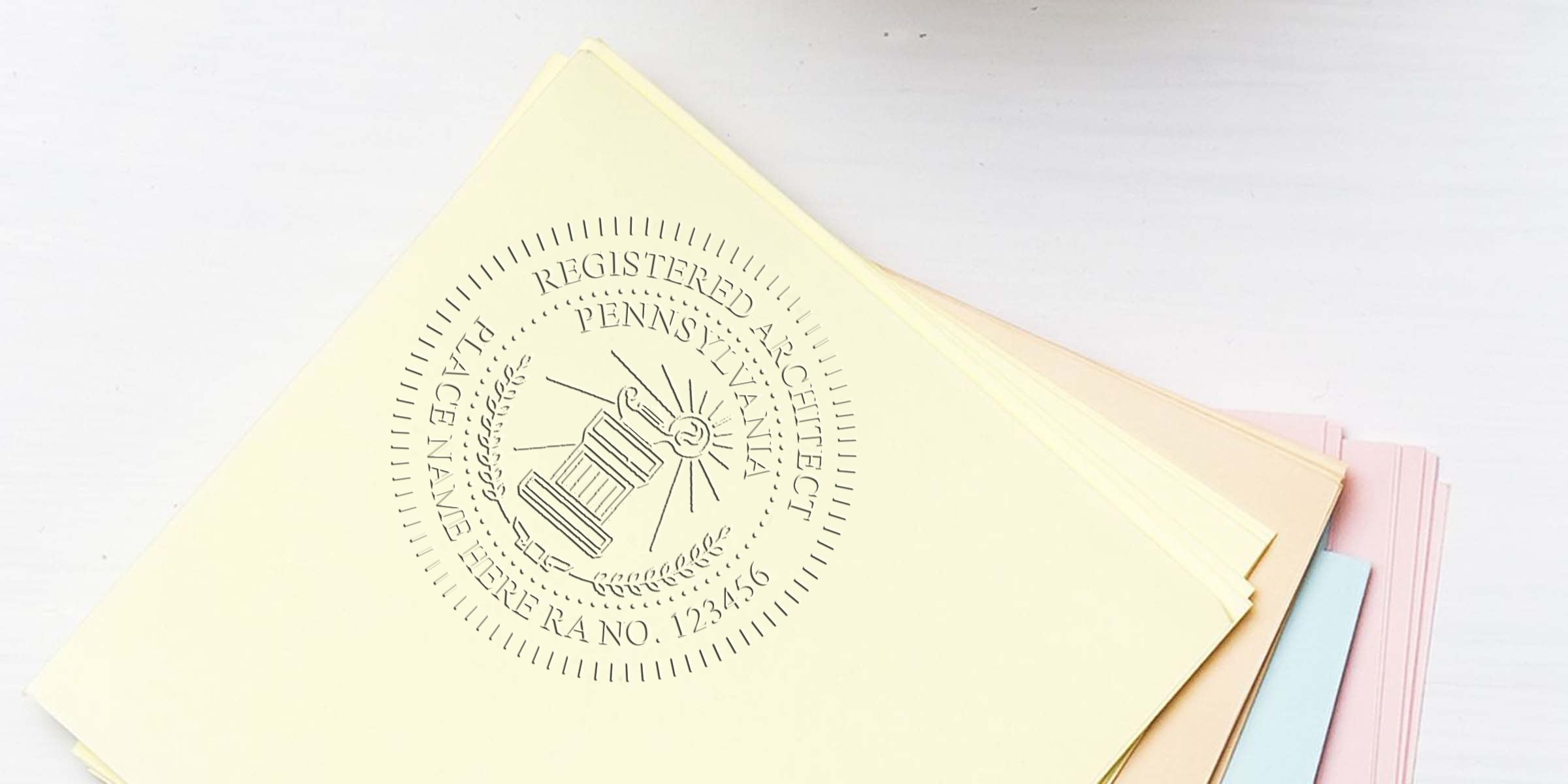 Custom embossed Pennsylvania architect stamp on pastel certificate paper with a self-inking stamp for professional license validation.