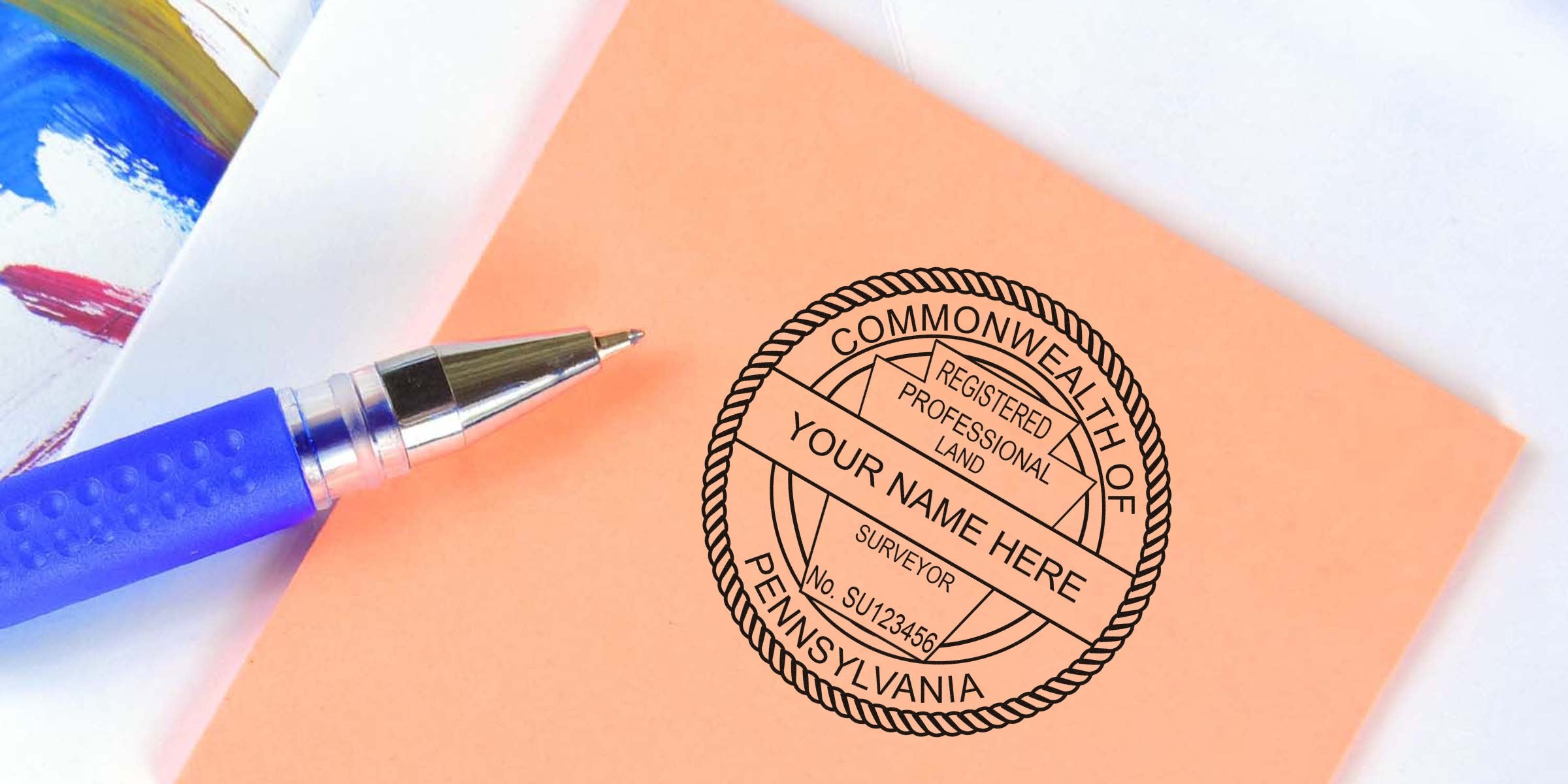 Blue pen next to Pennsylvania land surveyor seal and PA registered professional land surveyor certification stamp.