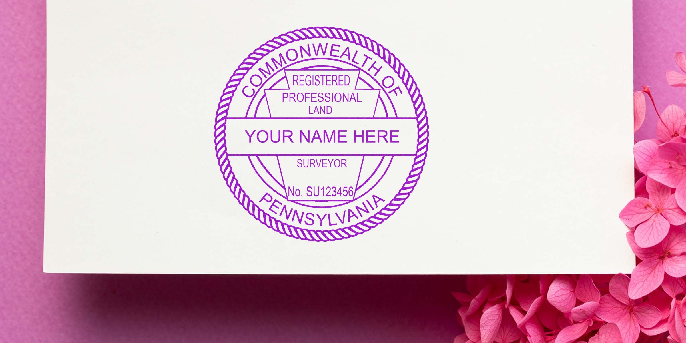 Custom Pennsylvania land surveyor seal on white paper with pink flowers, featuring a professional registered land surveyor stamp, perfect for seal and license renewal tips.