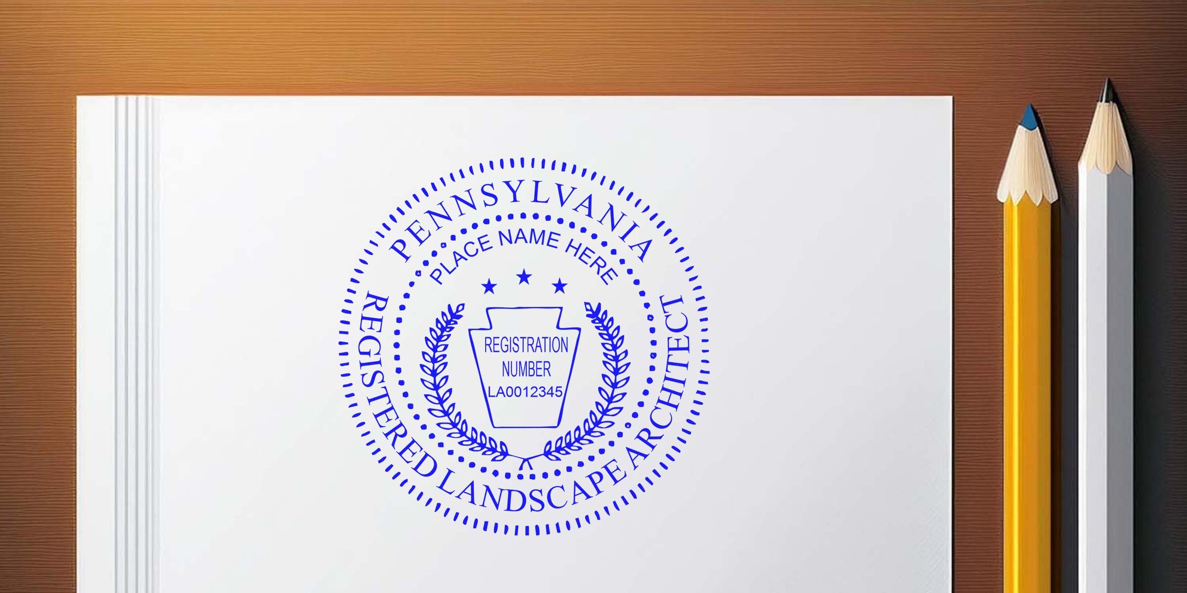 Pennsylvania landscape architect seal on white paper with pencils, highlighting seal design tips.