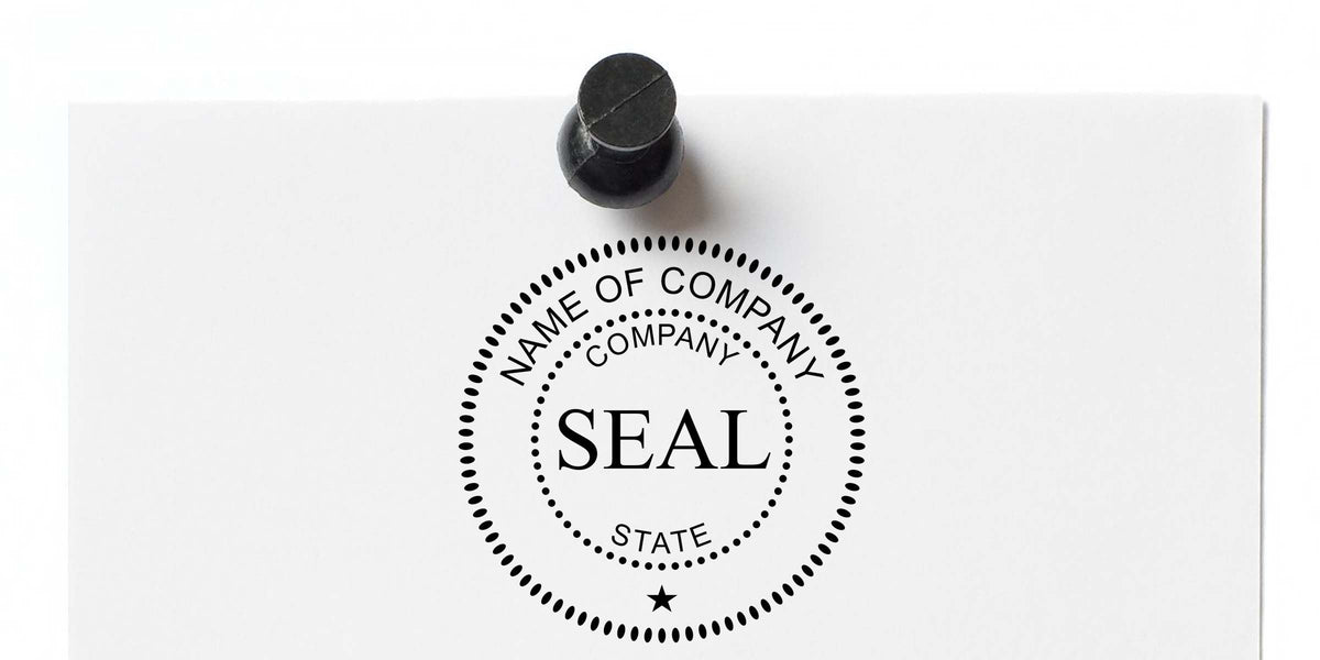 Black company seal stamp on white document with circular dotted logo, “Name of Company,” “Company,” and “State” text, and a centered “SEAL” imprint under a rubber stamp handle