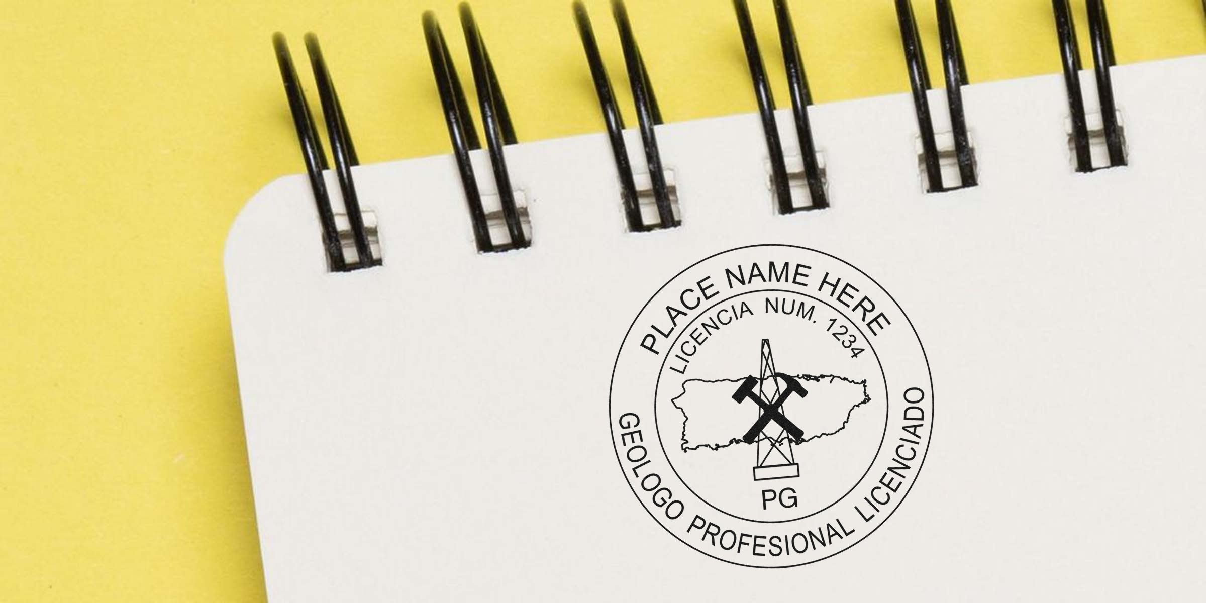 Rare geological stamps with a professional geologist license mark on a white spiral notebook against a yellow background, perfect for geologist stamp auction collectors.