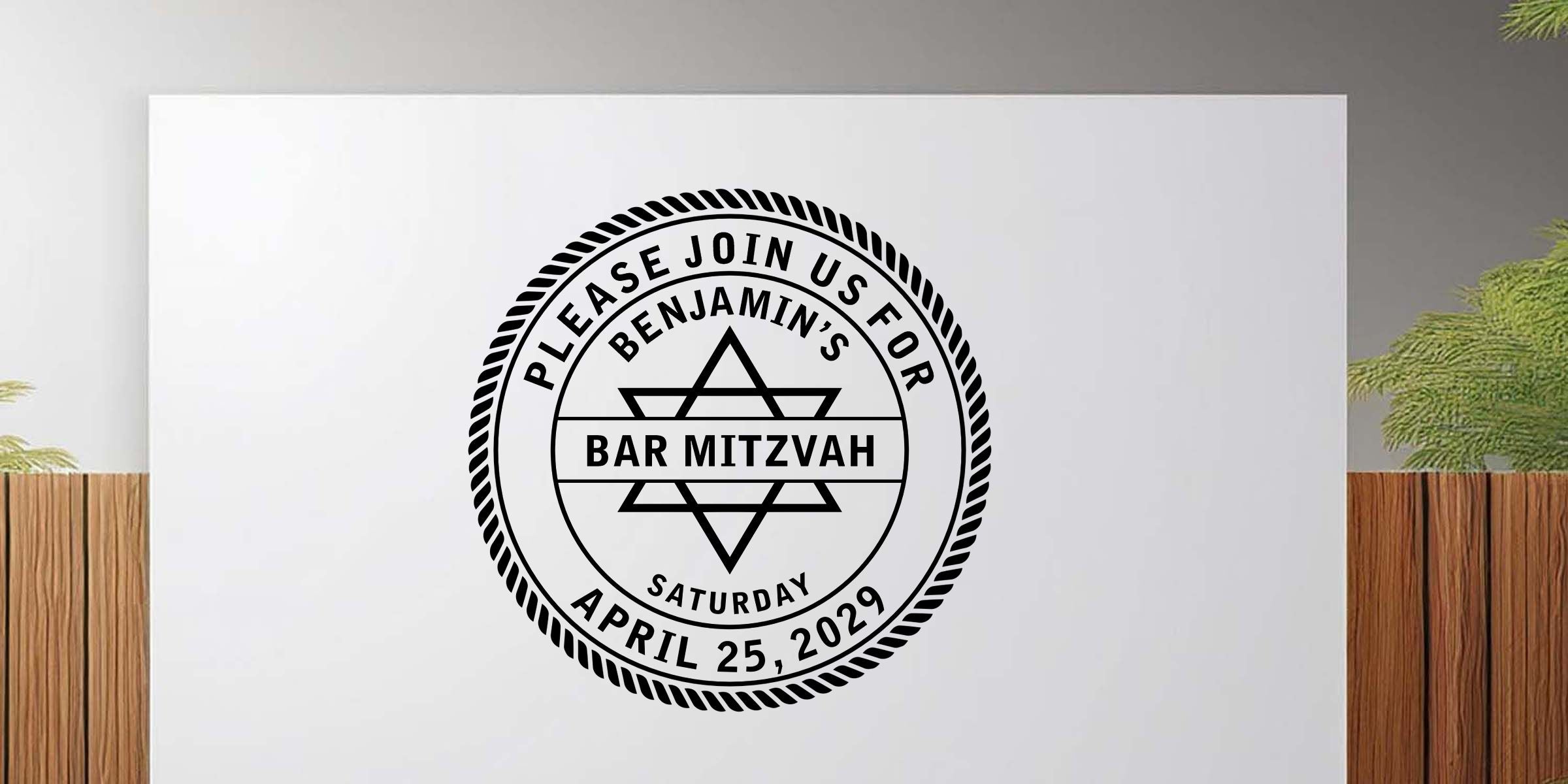 Custom Bar Mitzvah invitation design with a black Star of David emblem and circular stamp reading “Please join us for Benjamin’s Bar Mitzvah” and “Saturday April 25, 2029” on a white background
