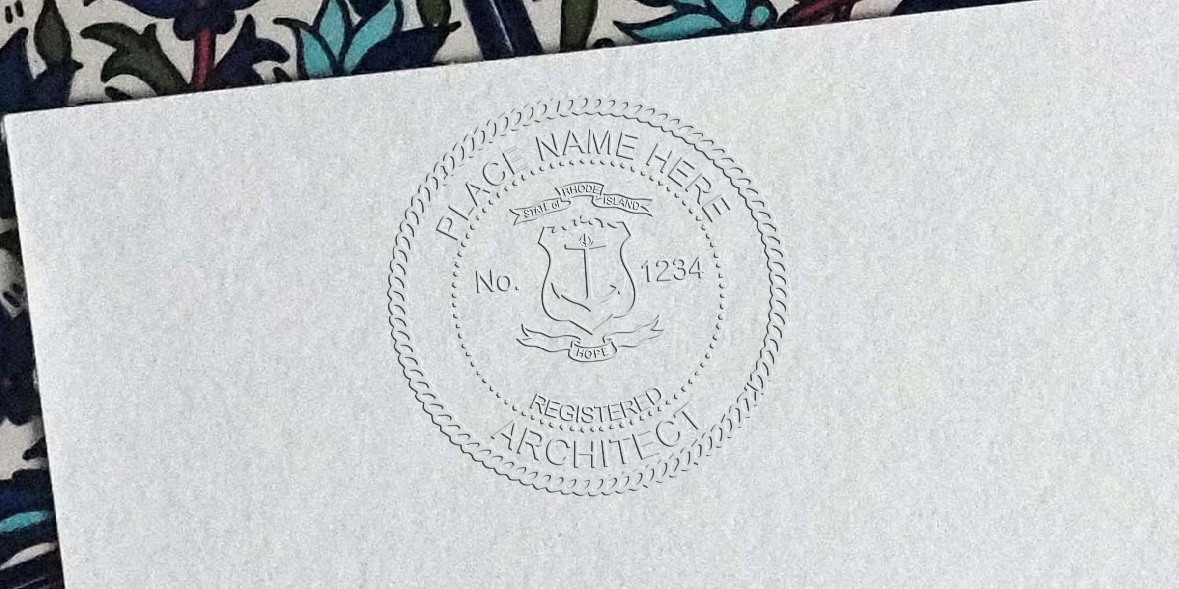 Embossed architect seal on white paper with Rhode Island state emblem and registration number, made by architect seal embossers for Rhode Island professionals.
